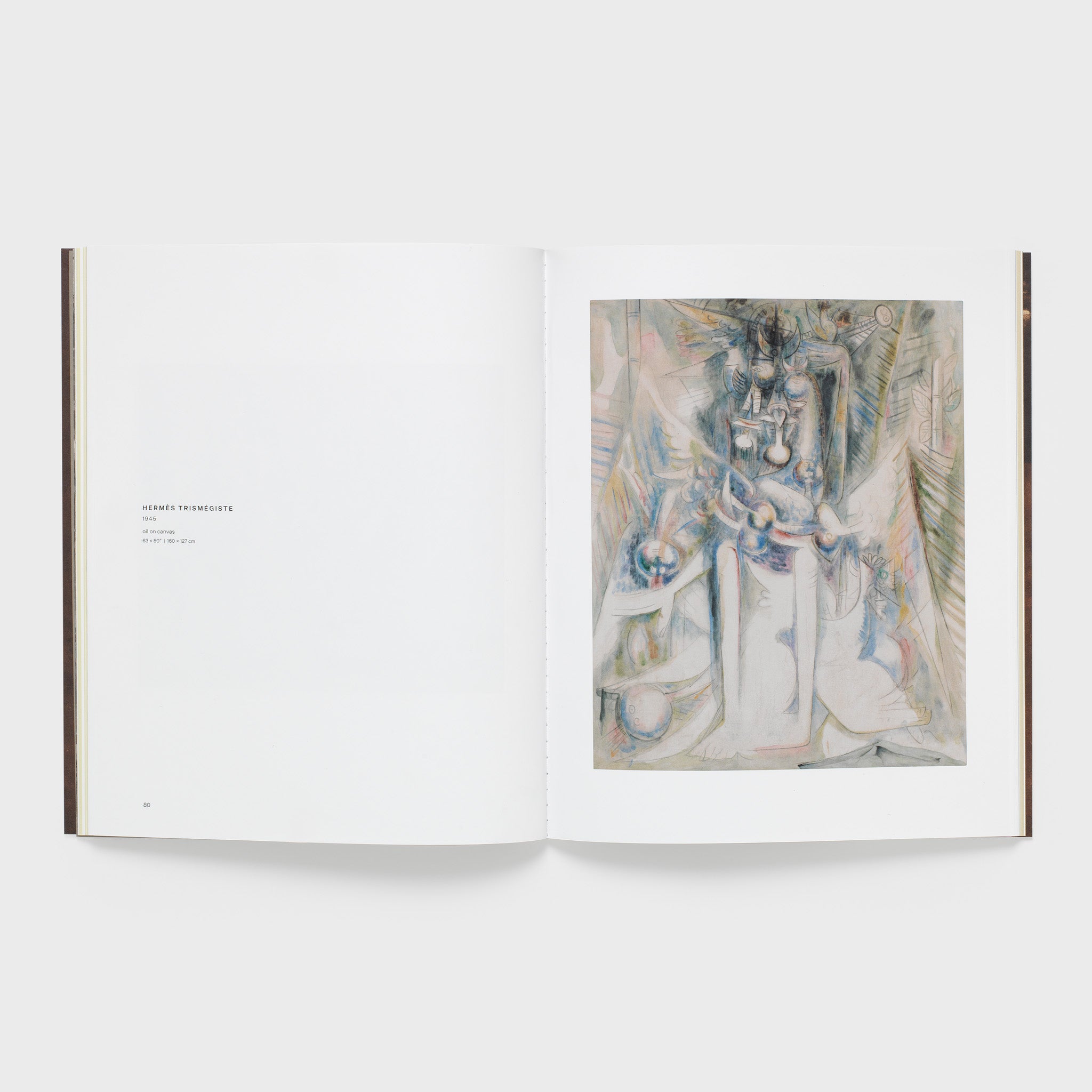 The book is open to two pages. There is a Lam work on the right page with a description of the work on the left. The background is white.
