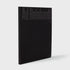 Ad Reinhardt: Color Out of Darkness, Curated by James Turrell book standing upright. Black cloth cover with black text.