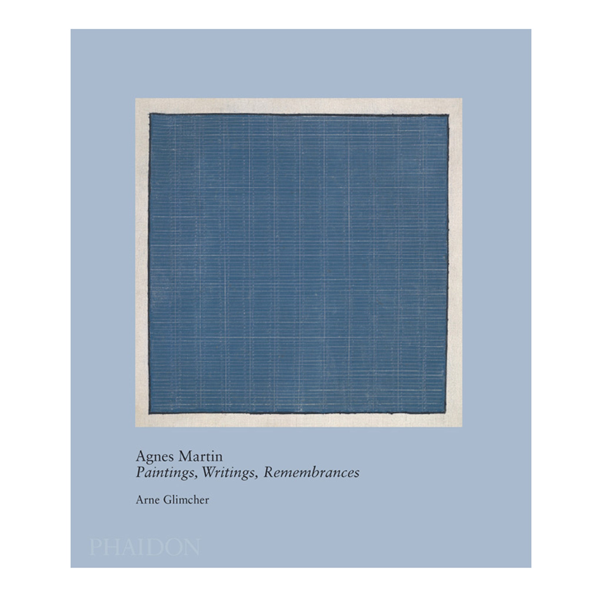 Agnes Martin Paintings, Writings, Remembrances by Arne Glimcher. The blue book is upright with a blue Agnes Martin painting on the cover.