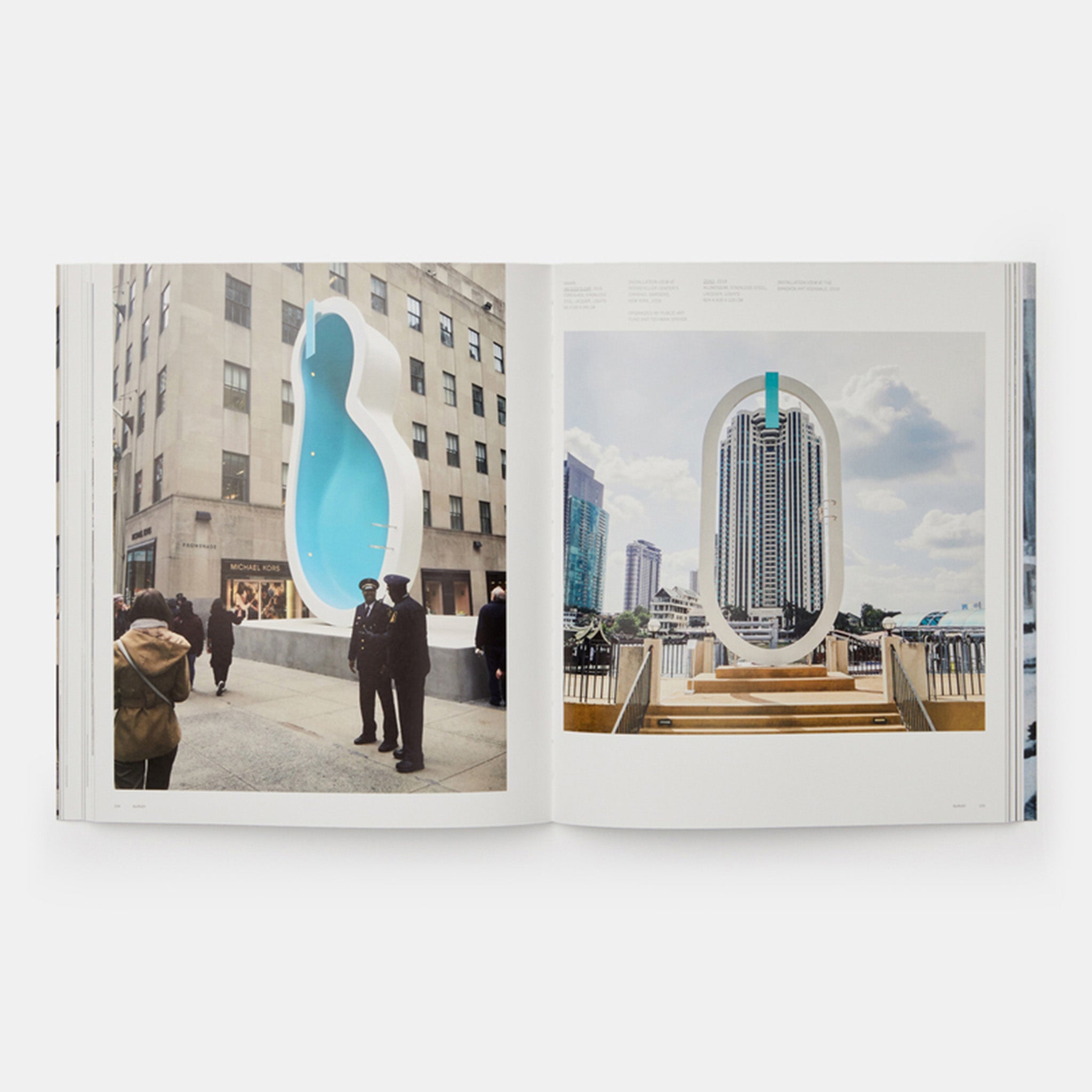 The book is open to two pages and has installation photos of Elmgreen & Dragset works in public spaces on both.