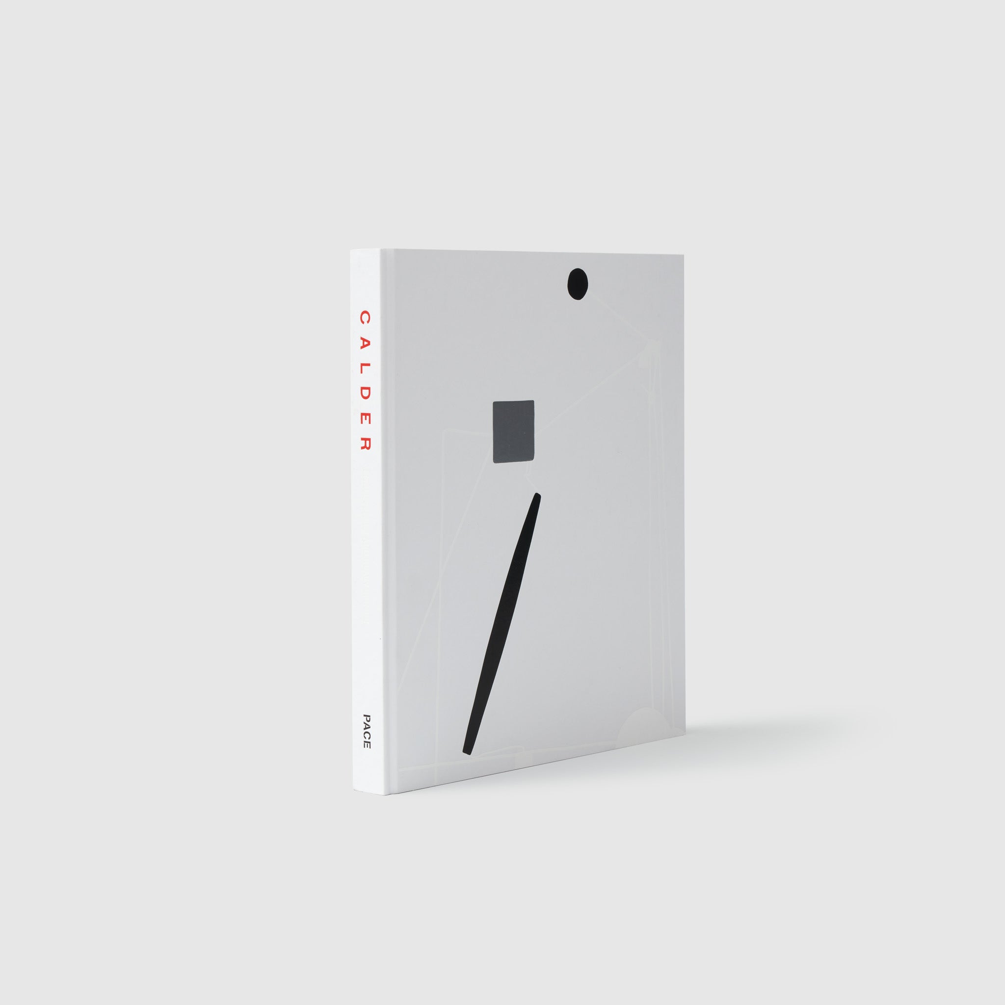 The book is standing upright with white and black shapes on the cover. It says Calder in red letters down the spine with Pace in black letters at the base of the spine.