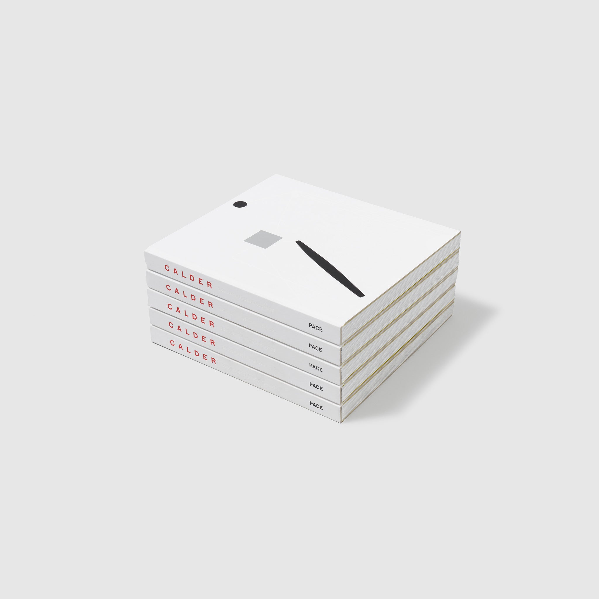 There are five Calder books stacked on top of each other.