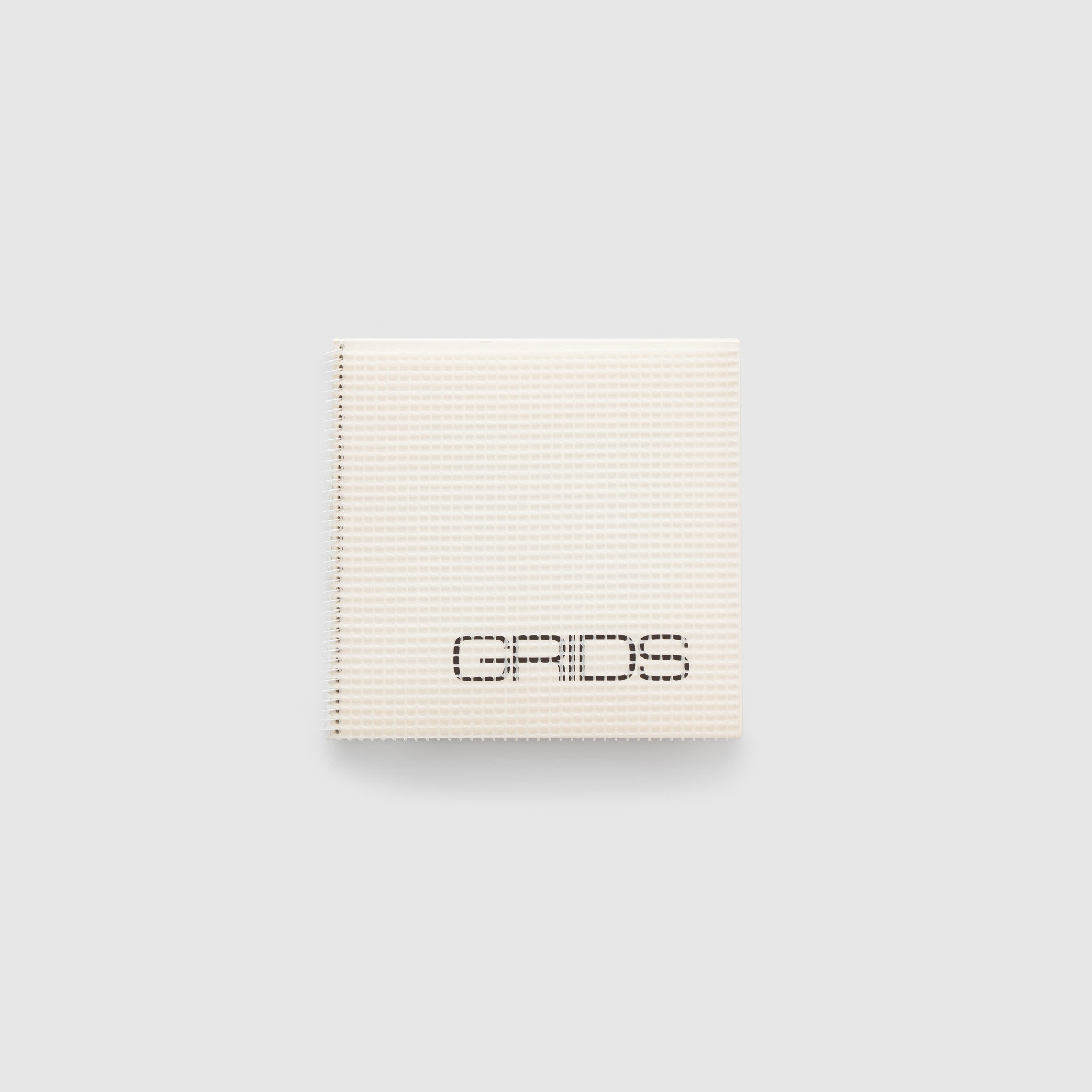 Grids. There is a white grid cover overlaying a white cover with black text.