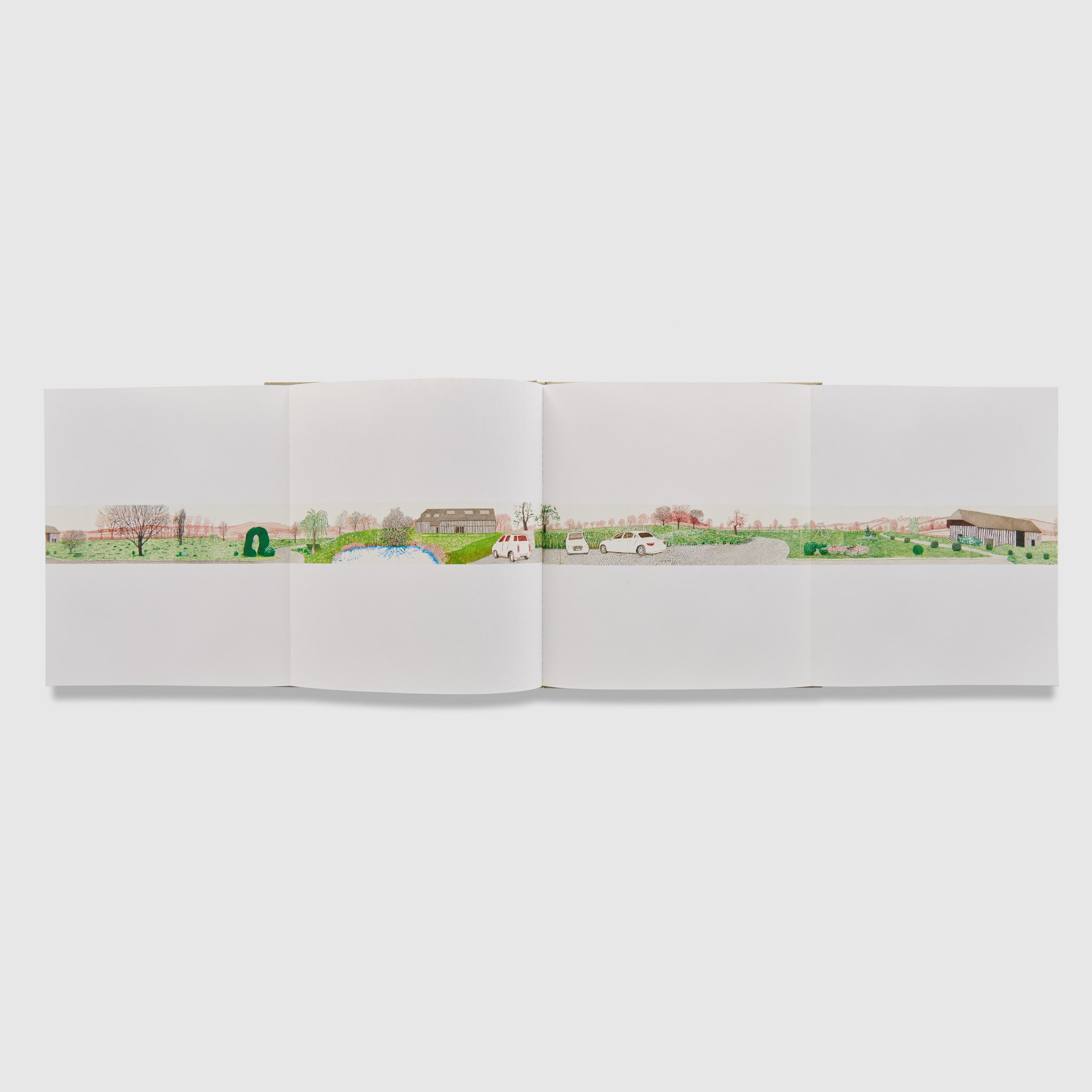 The book is open to two pages with fold out into a four page spread. Across all four pages is an iPad drawing of a village.