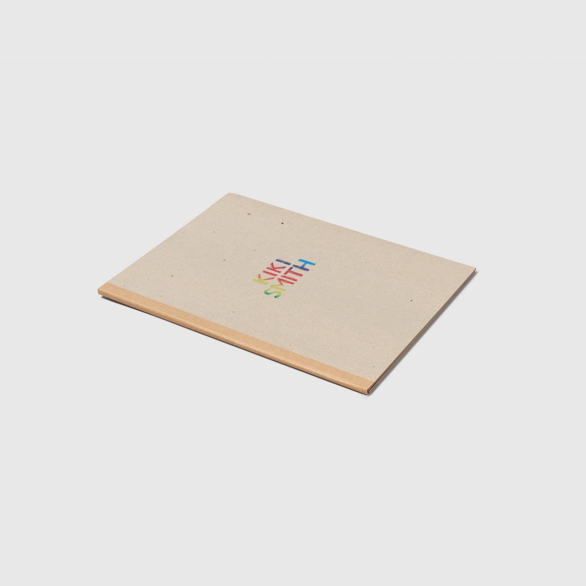 Kiki Smith. The text is metallic rainbow and the cover is a light brown with a darker brown spine.