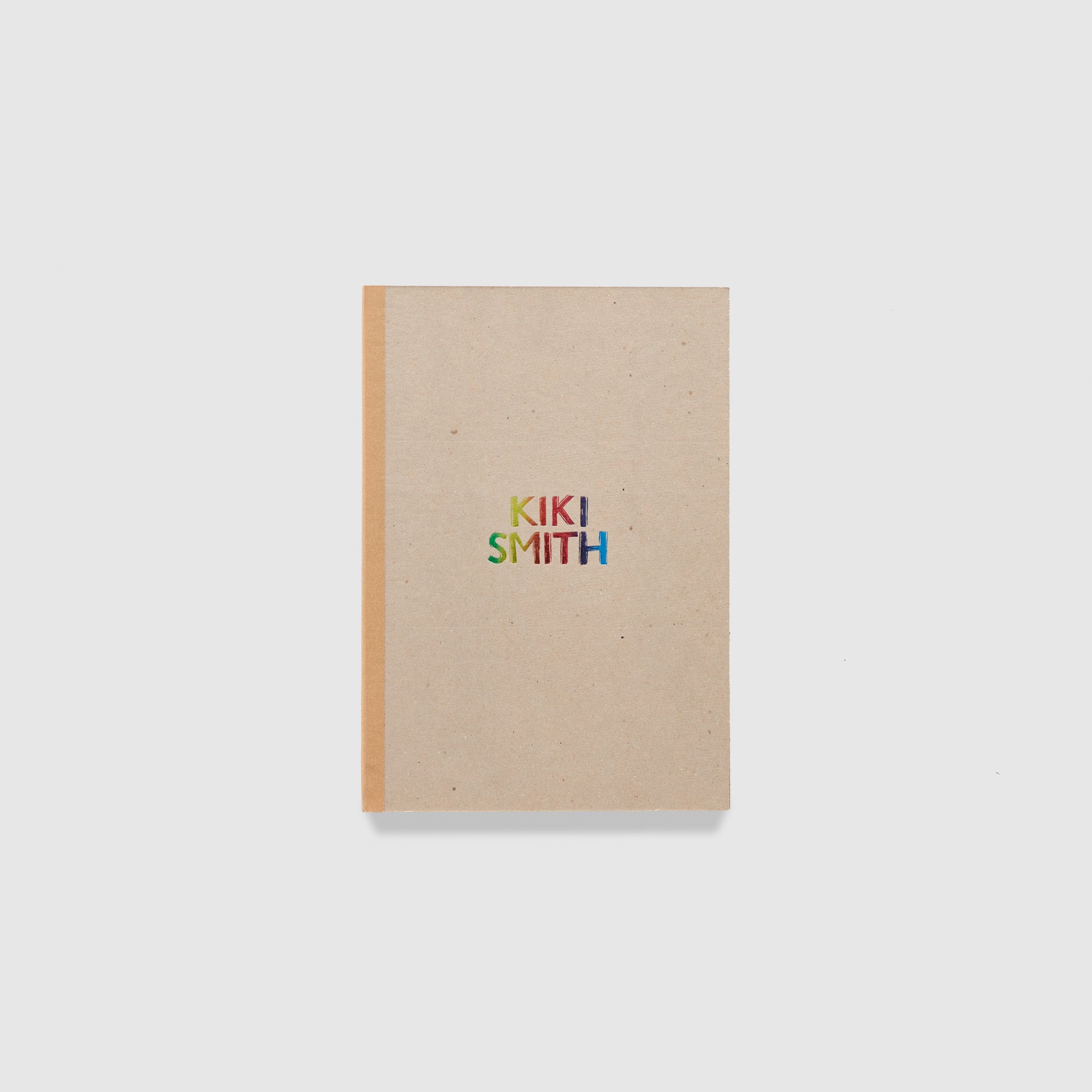 Kiki Smith. The text is metallic rainbow and the cover is a light brown with a darker brown spine.