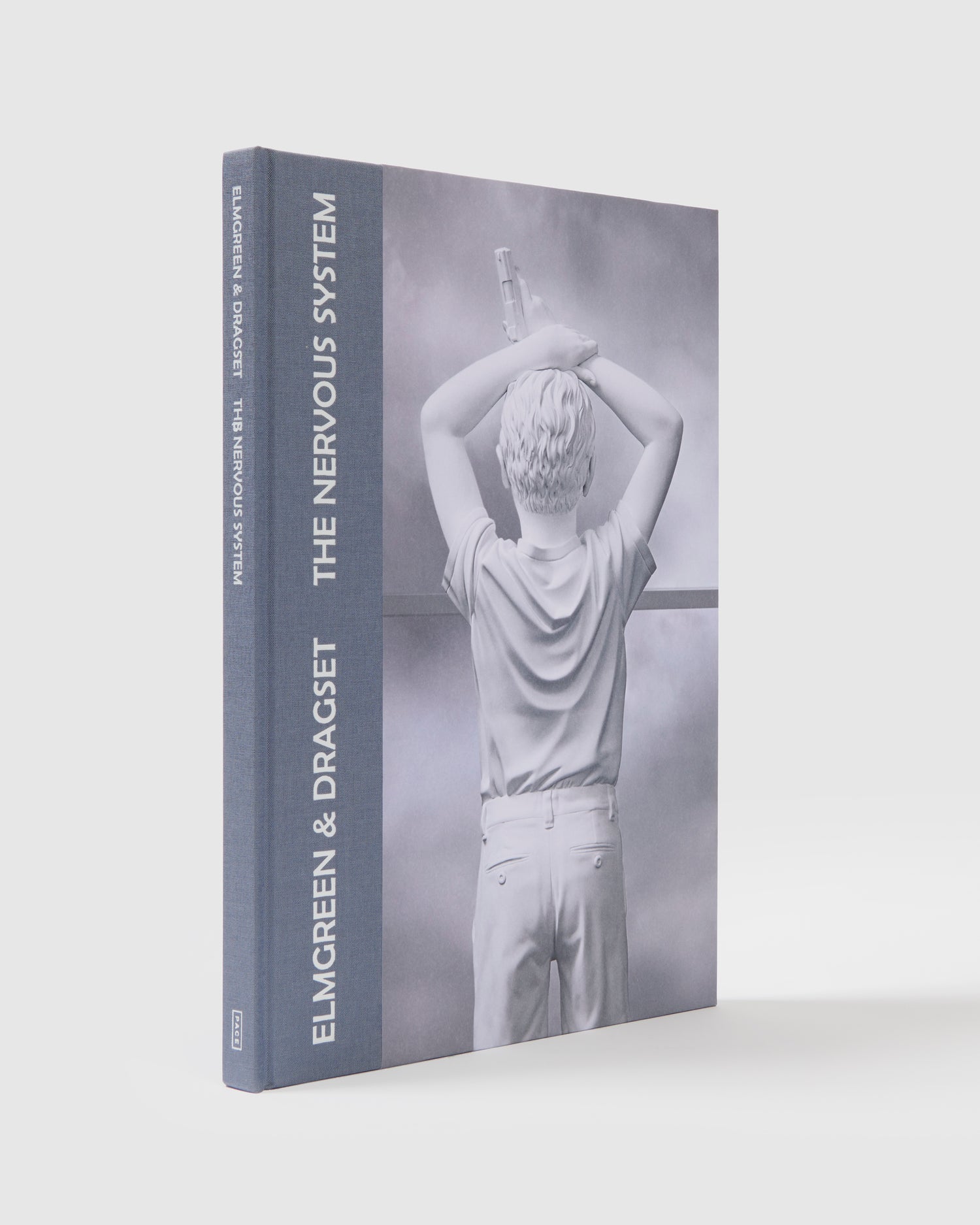 Elmgreen & Dragset The Nervous System. The cover has a blue spine and has an image of an Elmgreen & Dragset work on it.