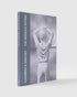 Elmgreen & Dragset The Nervous System. The cover has a blue spine and has an image of an Elmgreen & Dragset work on it.