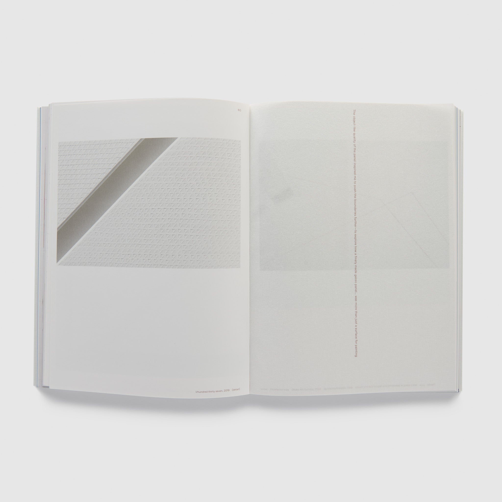 The book is open to two pages. The left page has a work by the artist and the right page has a quote from the artist.