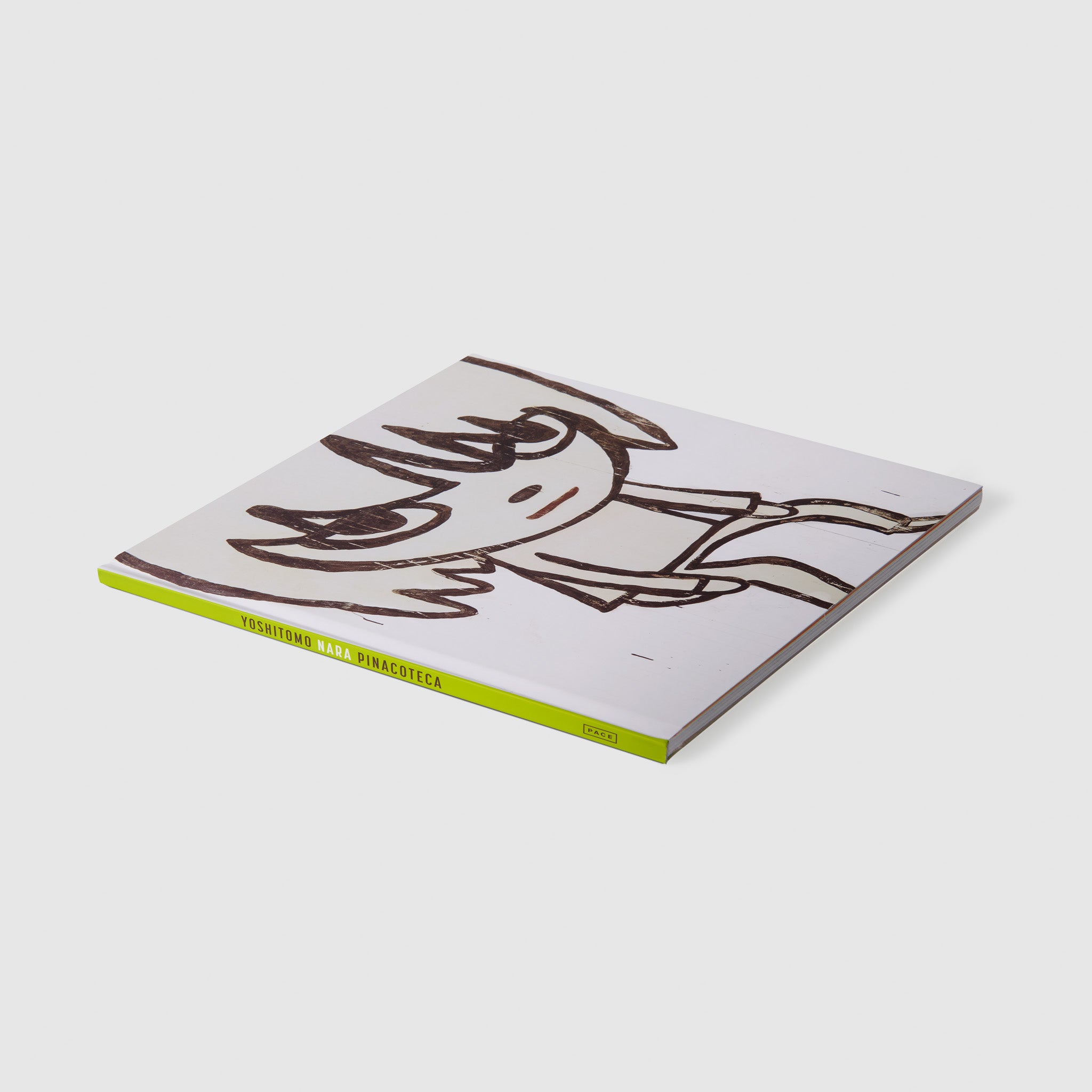 Yoshitomo Nara Pincoteca. The book has a black and white Nara work on the cover. There is a green spine with black and white font.