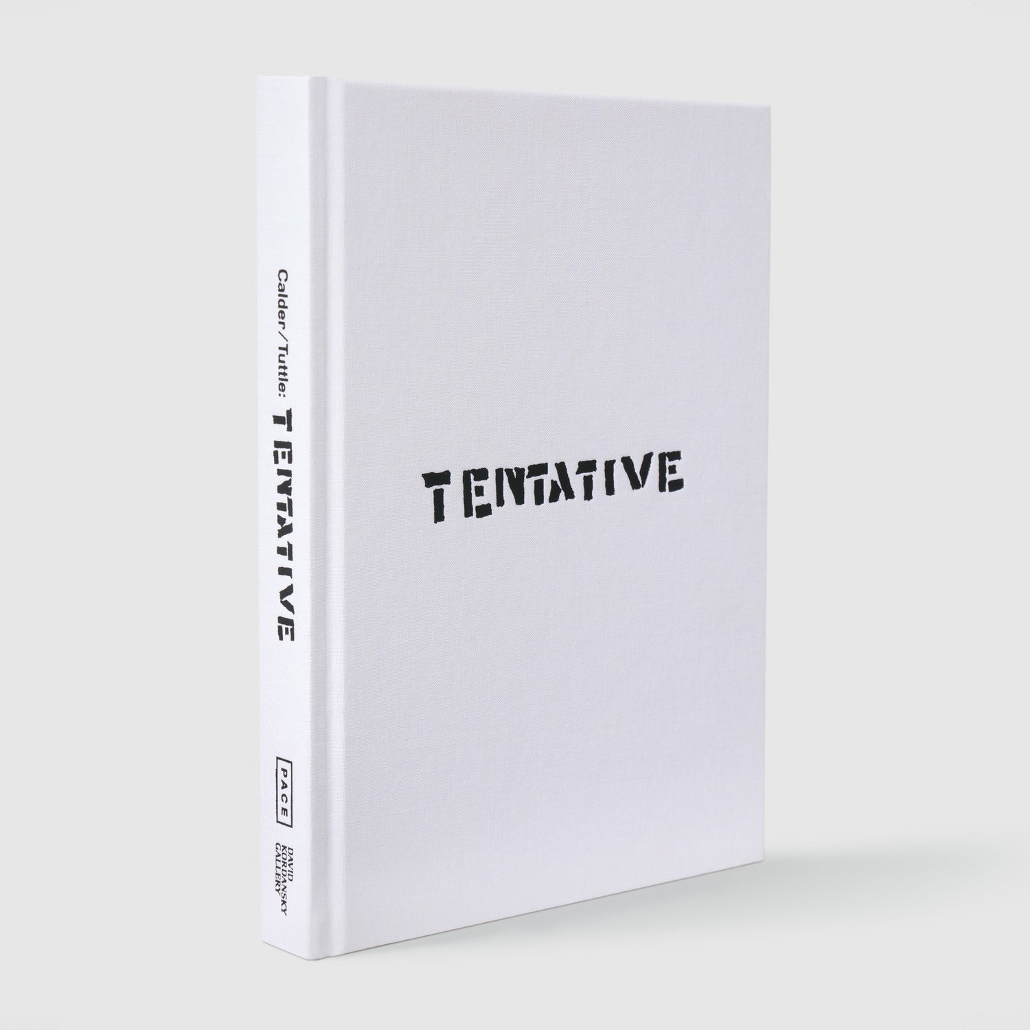 Calder Tuttle Tentative. The book has a white fabric cover with black text.