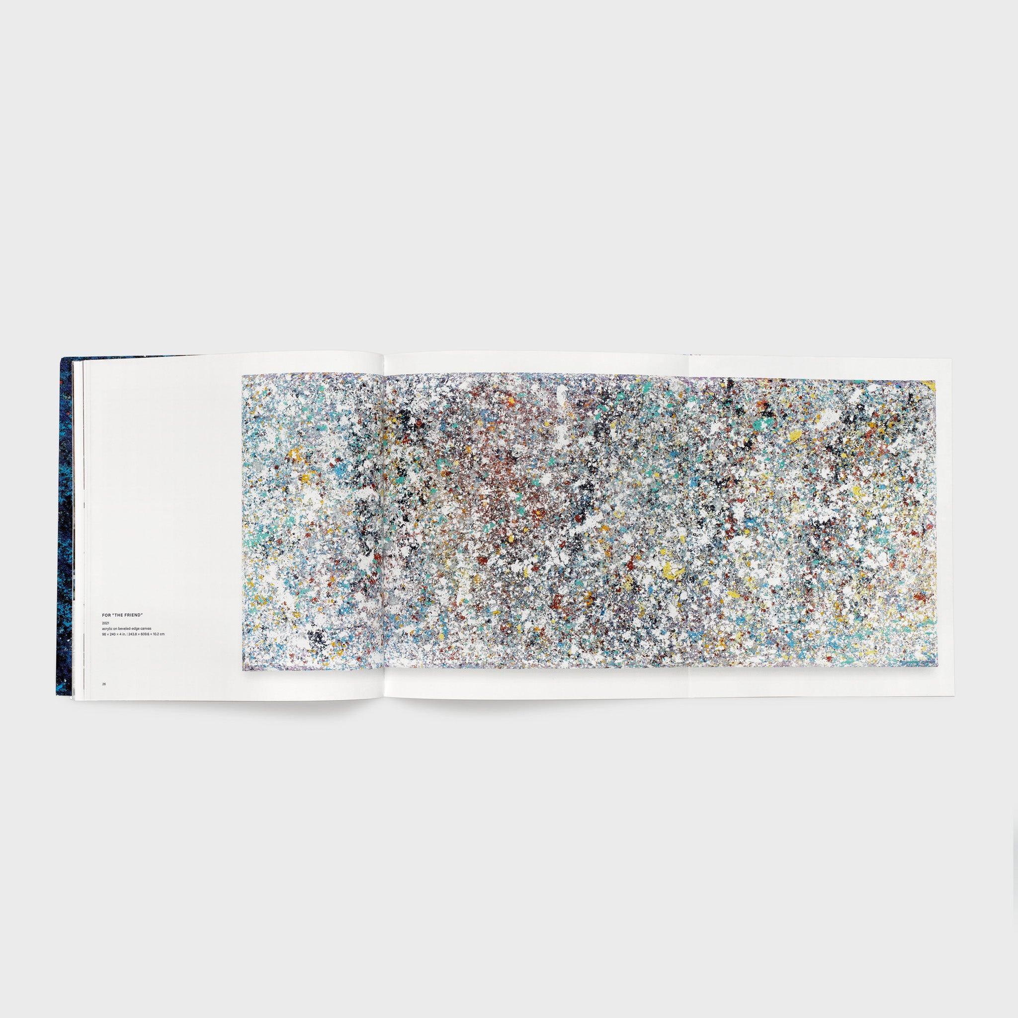The book is open to two pages with a foldout opened on the right page. An image of one Gilliam work spans all three pages.