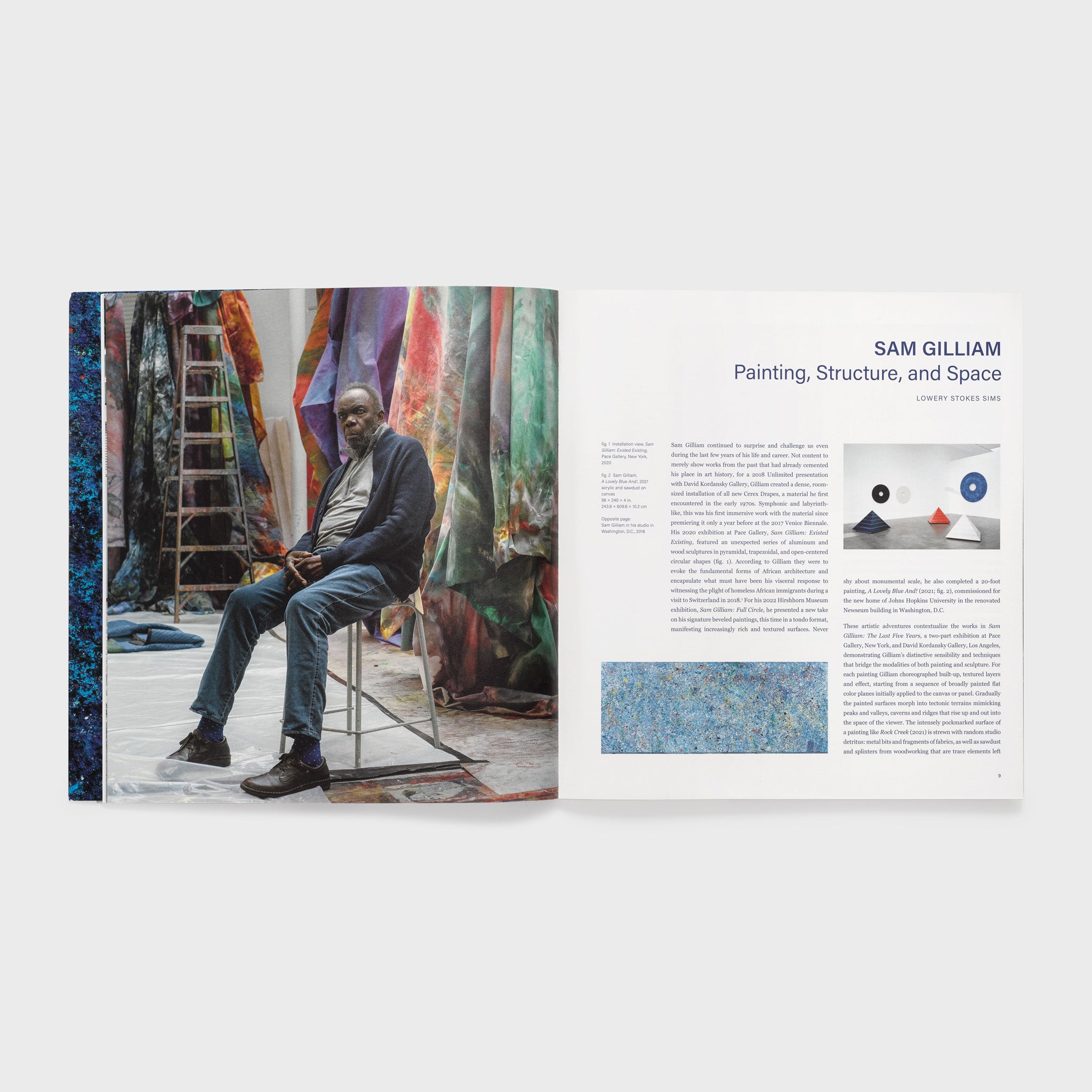 The book is open to two pages. The left page has a portrait of the artist in his studio. The right page has an essay about the artist.