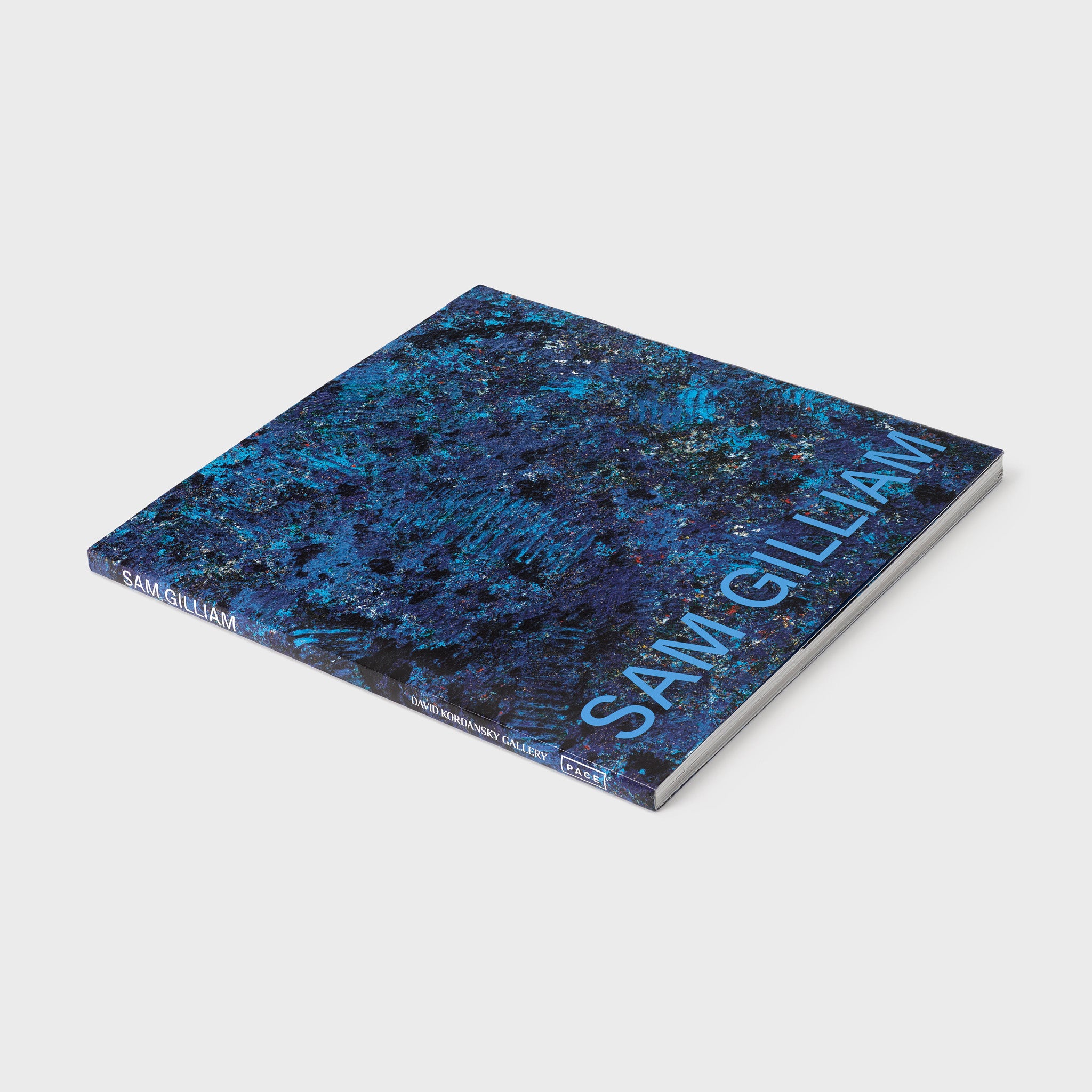 Sam Gilliam. The cover feature an image of a blue work by Gilliam. The font is blue.