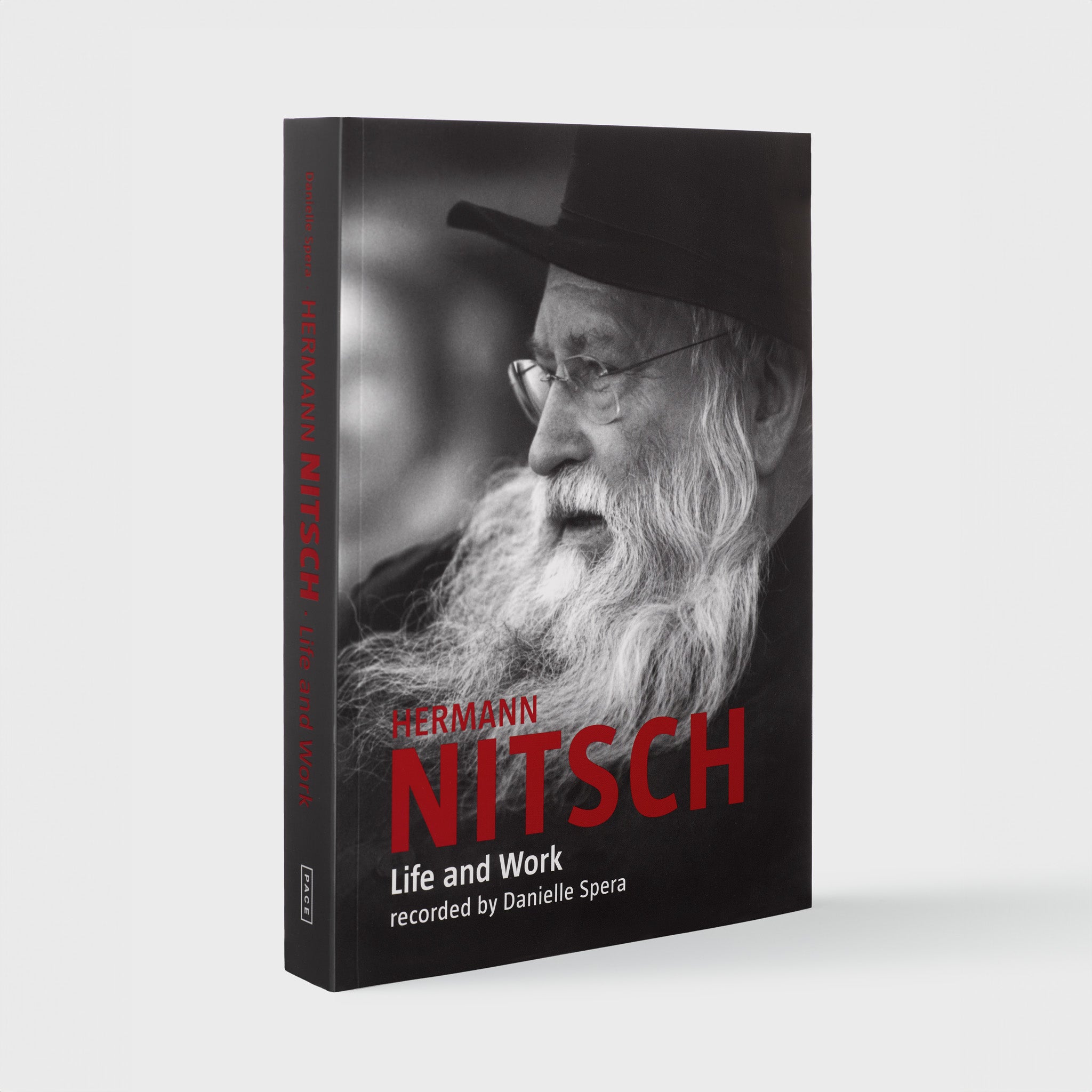 Hermann Nitsch Life and Work recorded by Danielle Spera. The cover is black with red and white text. There is a black and white image of the artist.