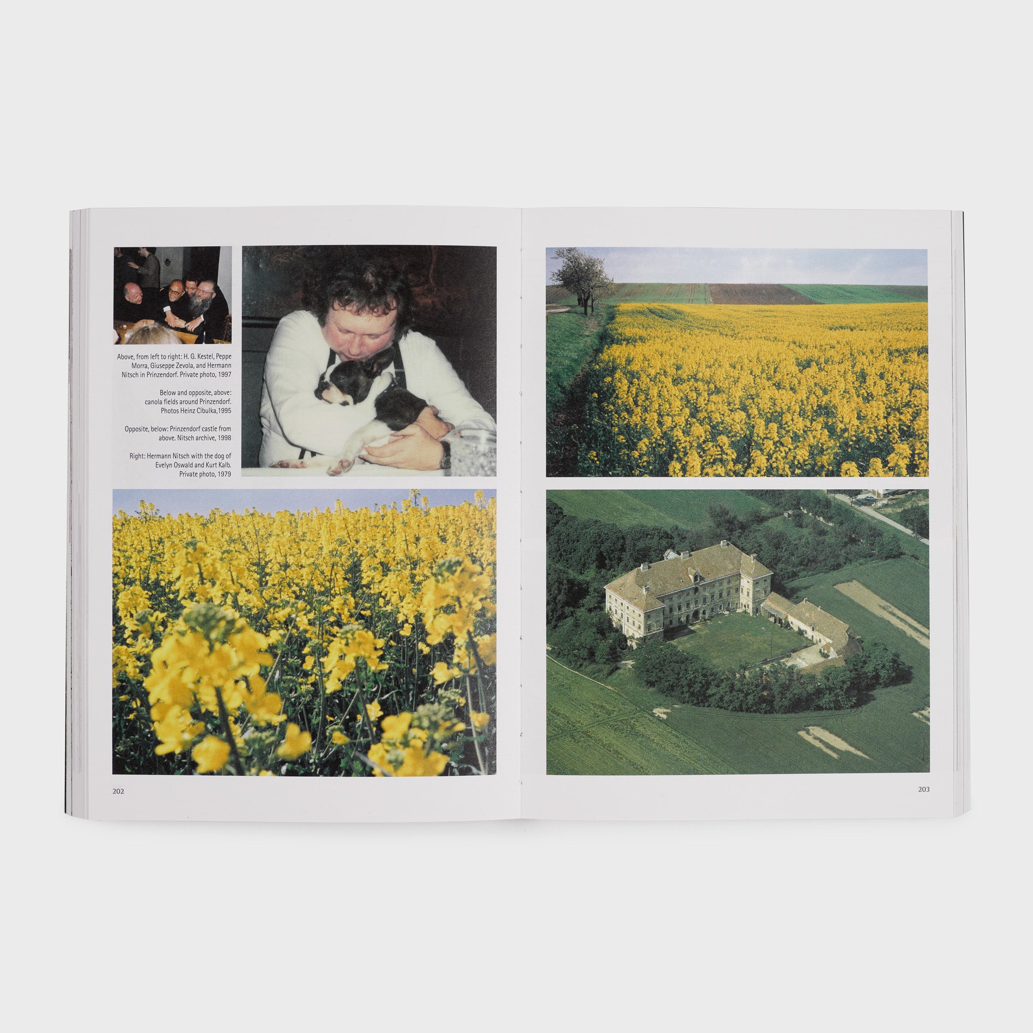 The book is open to two pages and has a four photos showing the artists estate and yellow flowers.