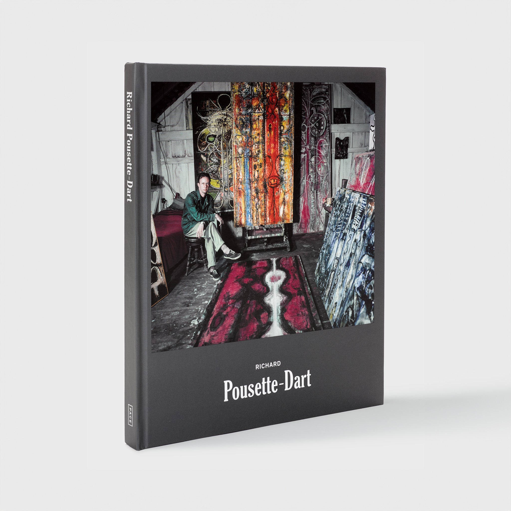 Richard Pousette-Dart. The cover is grey with a photograph of the artist in his studio. The font is white.