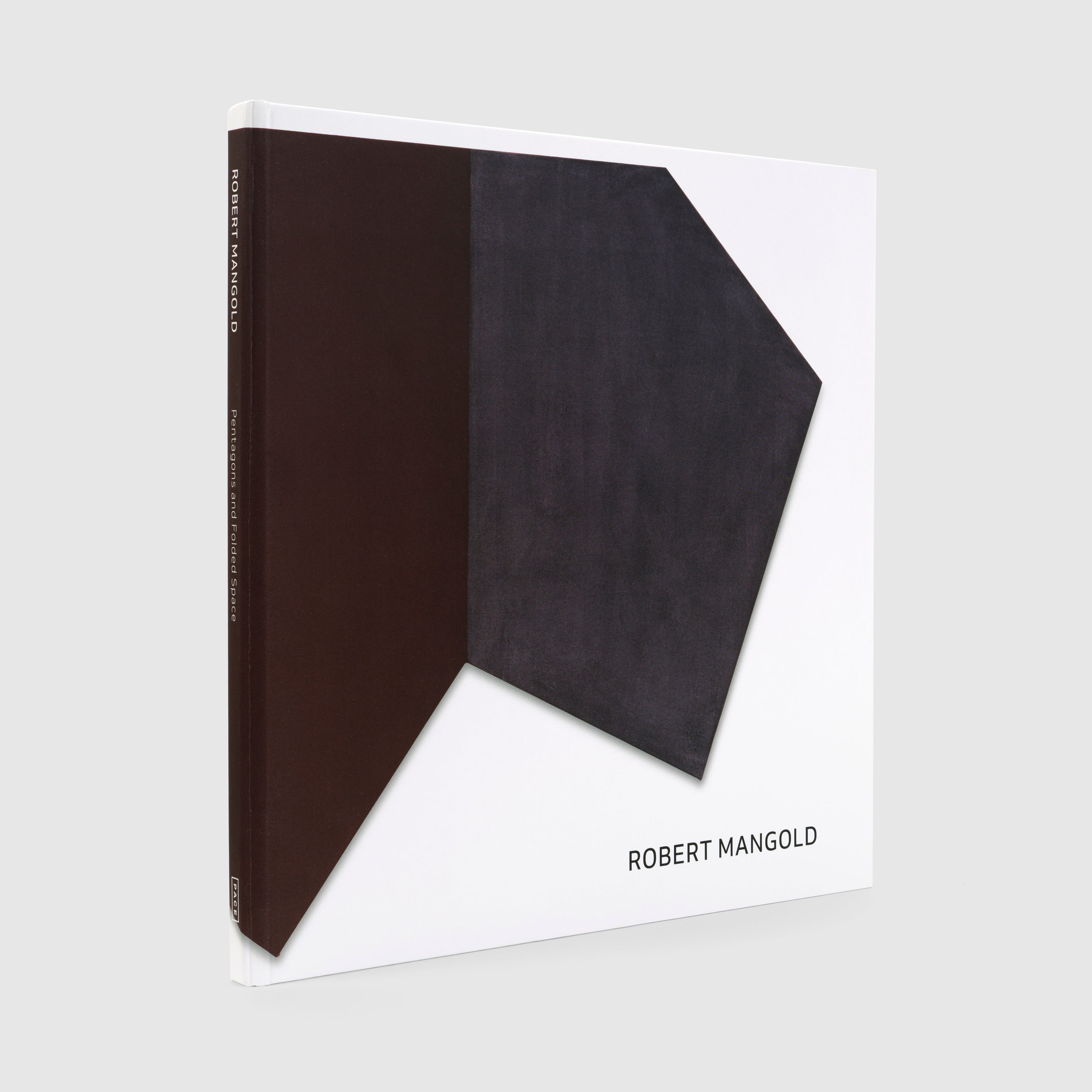 Book with black and white geometric design on a gray background