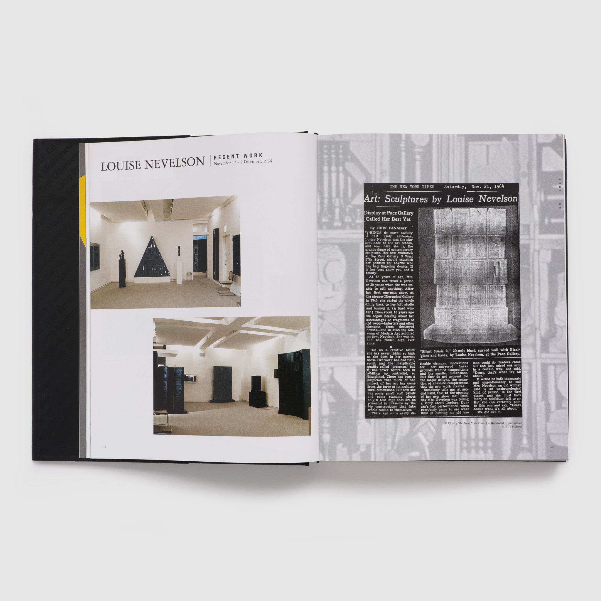 The book is open to two pages and there are two photographs of a Louise Nevelson exhibition from 1964 on the left page and a New York Times news clipping from 1964 on the right.