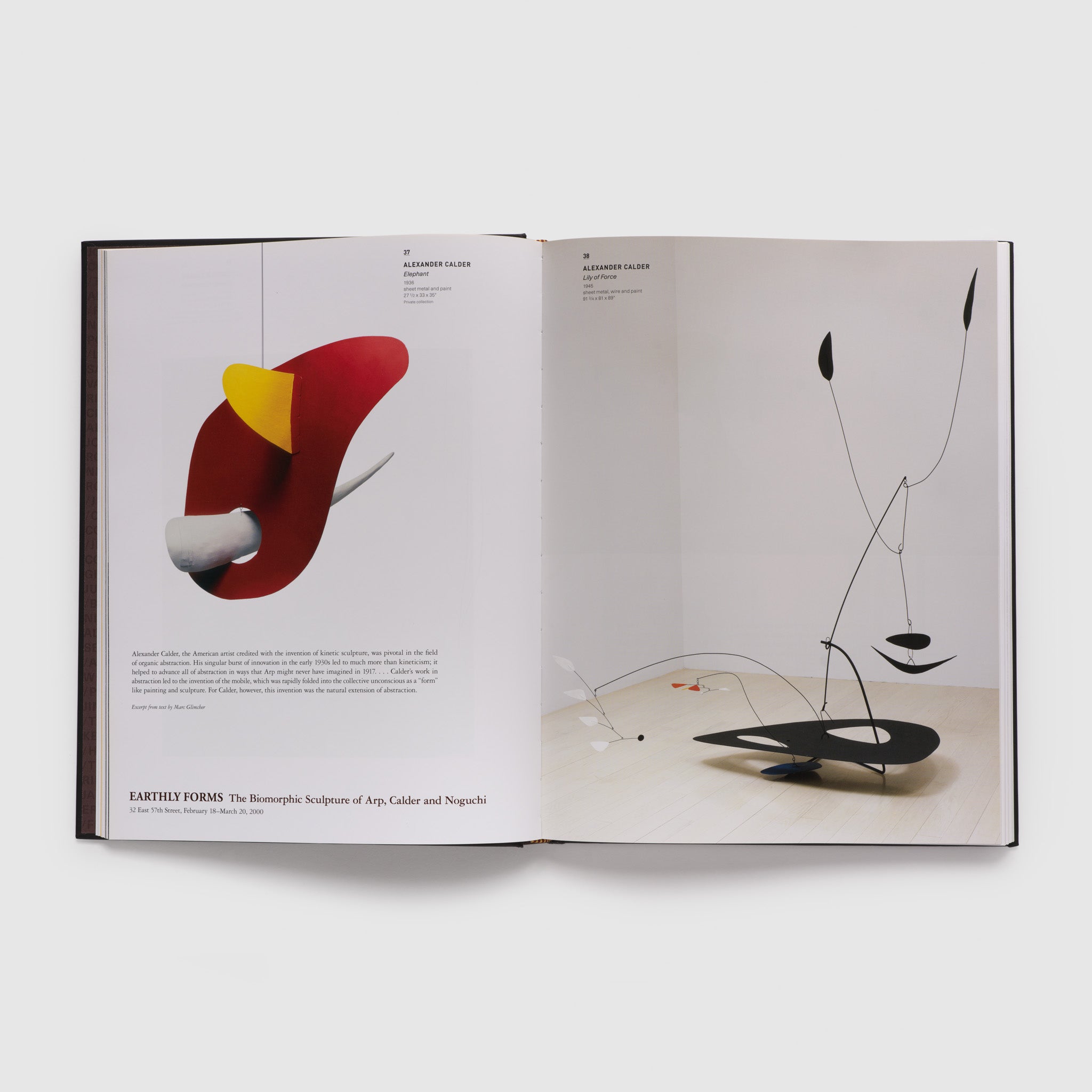 Two page spread containing color photography of two of Alexander Calder&