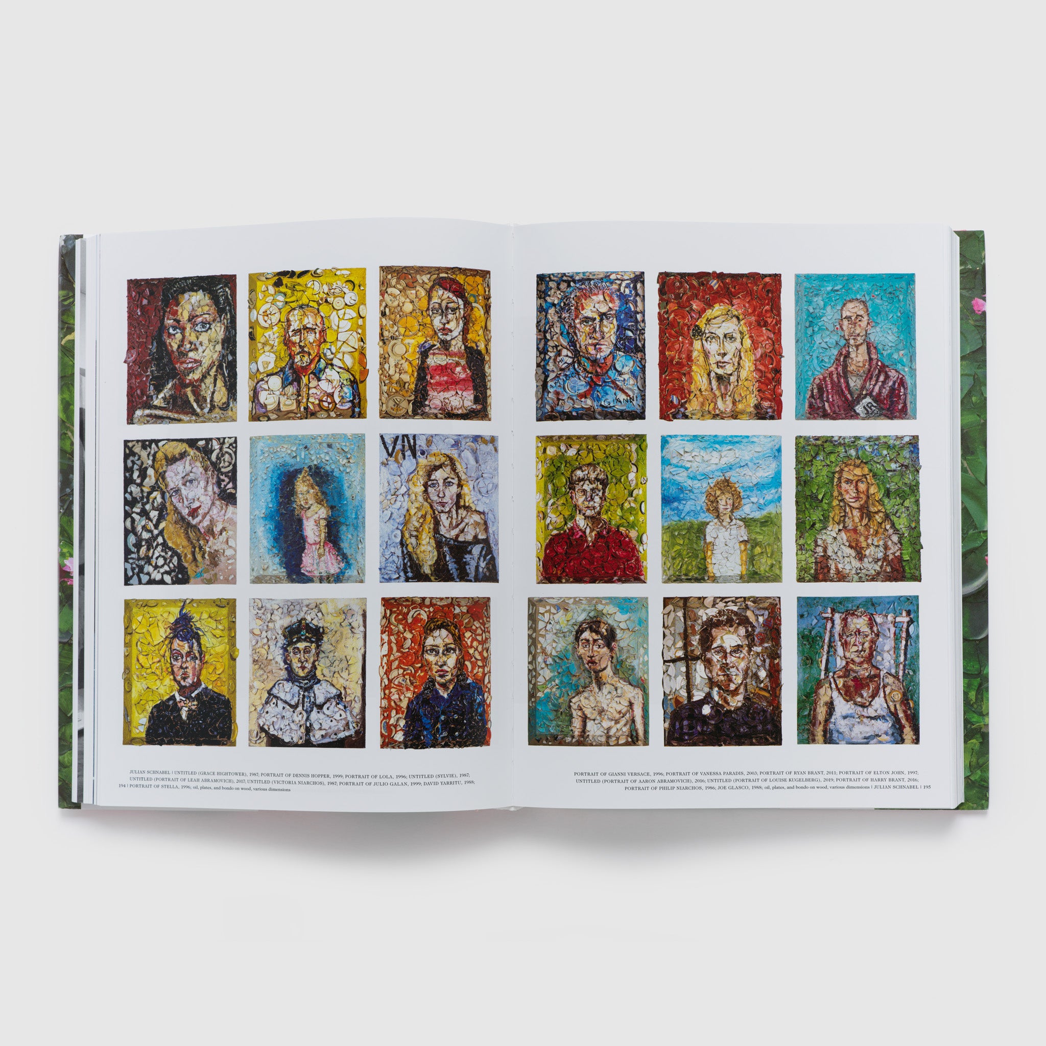 The book is open to two pages and has 18 broken plate portraits across the pages.