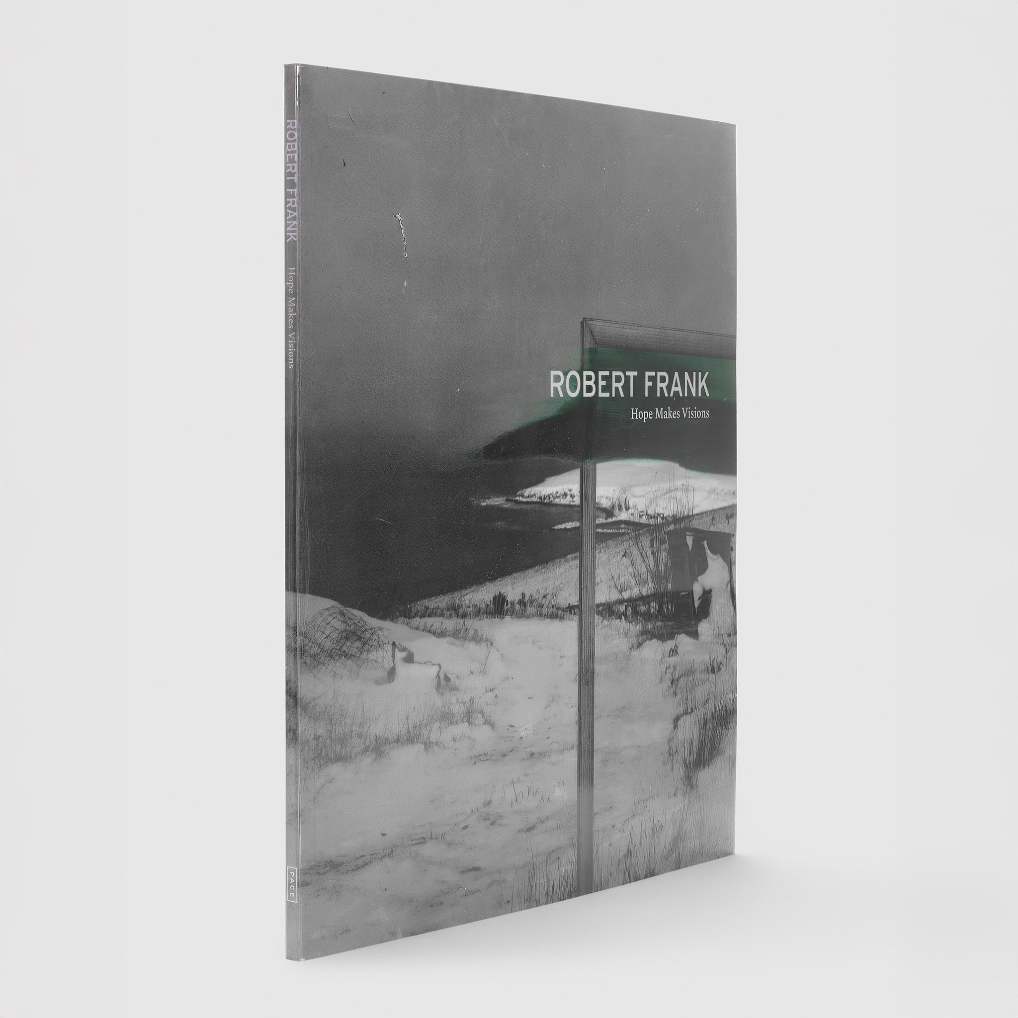 "Robert Frank Hope Makes Visions" is in white lettering. The background is white and black Robert Frank photograph of a coastline.