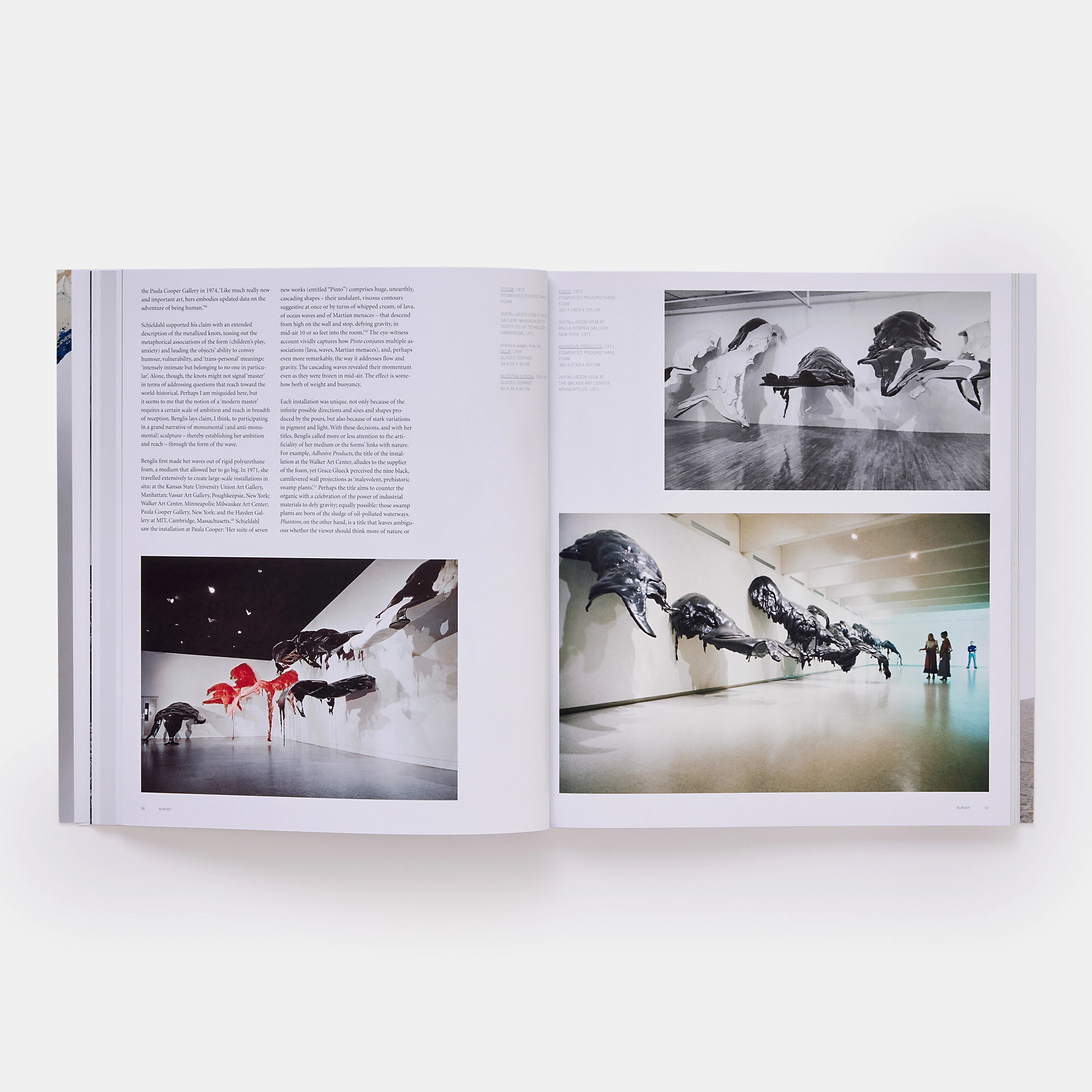 The book is open to two pages. The right page has two images of Benglis works installed in a gallery. The left page has a photograph Benglis works in a gallery with an essay at the top of the page.