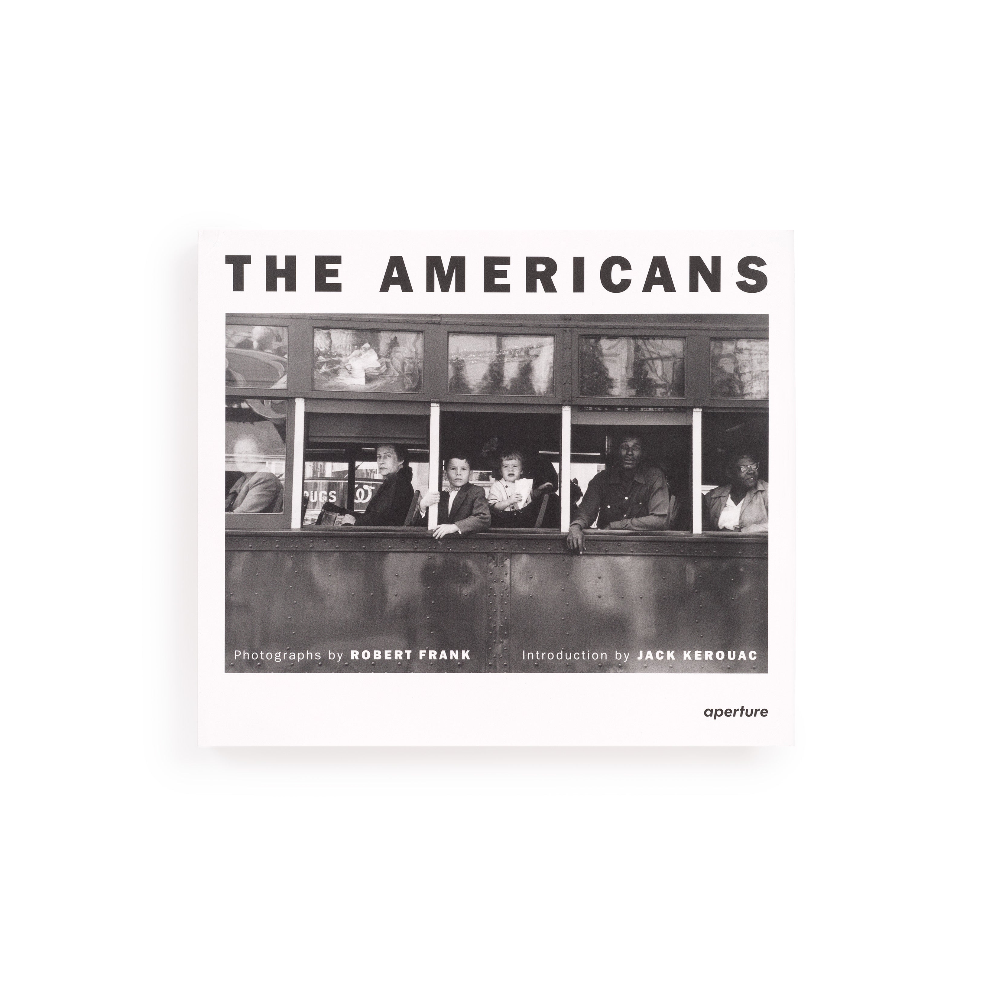 The book cover is white with the title "The Americans" in black letters. There is a black and white photo by Robert Frank on the cover.