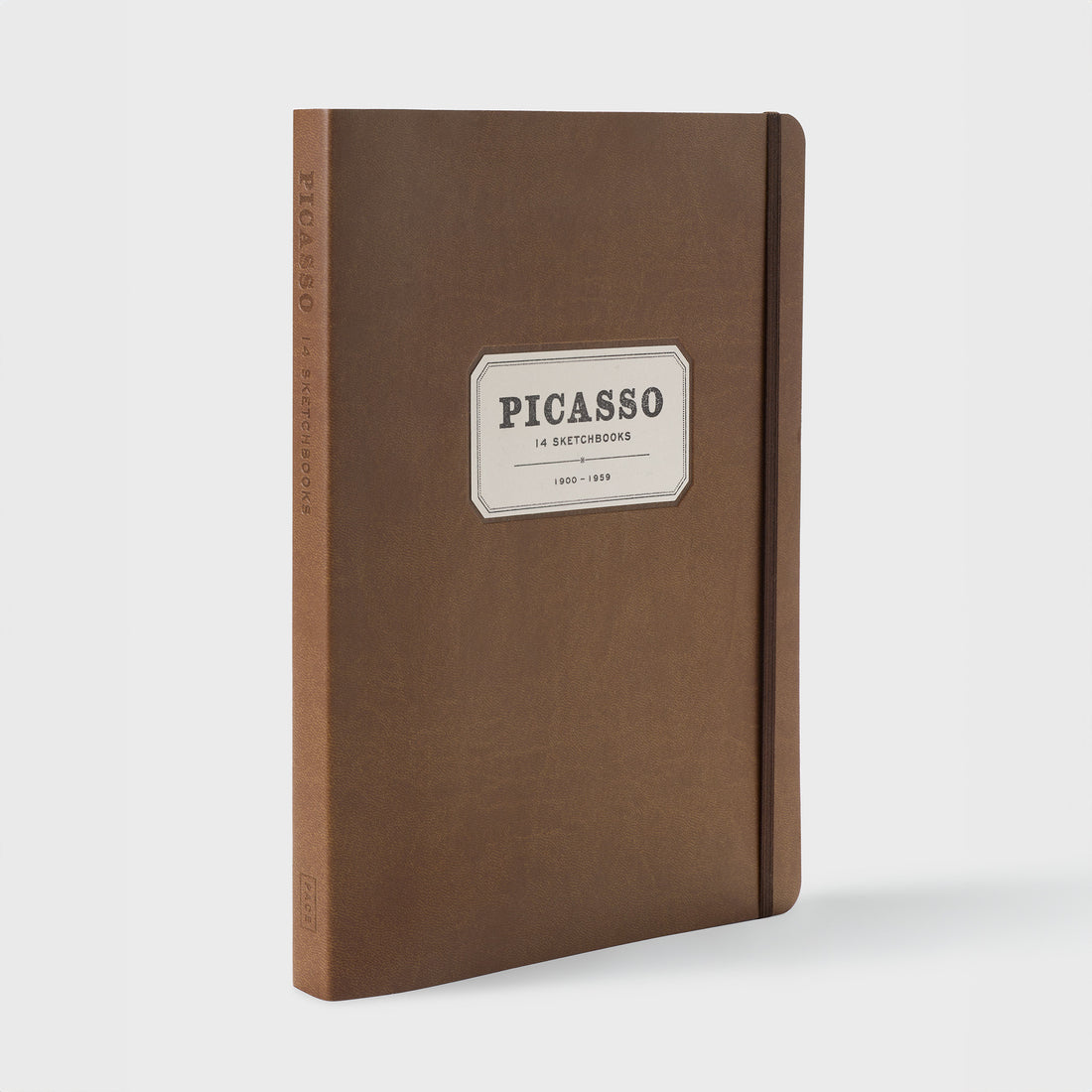 Picasso 14 Sketchbooks 1900-1959. The background is brown leather and has a brown strap to keep the book closed.