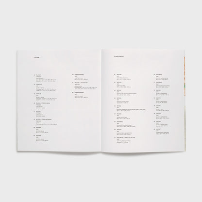 The book is open to two pages. The left page has a list of all of the Lee Ufan works in the show and the right page has the Claude Viallat works that are included.