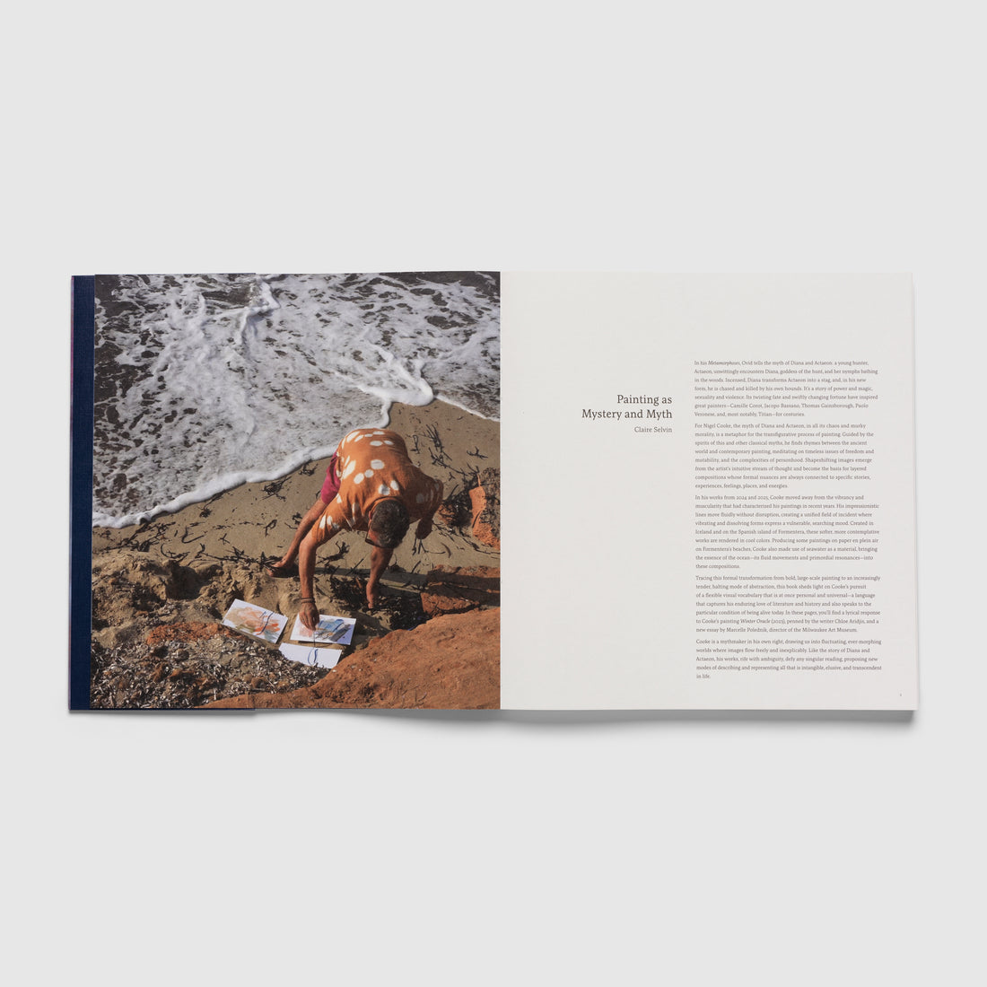 Book open to a page with a photo of a person on a beach and text on a white background