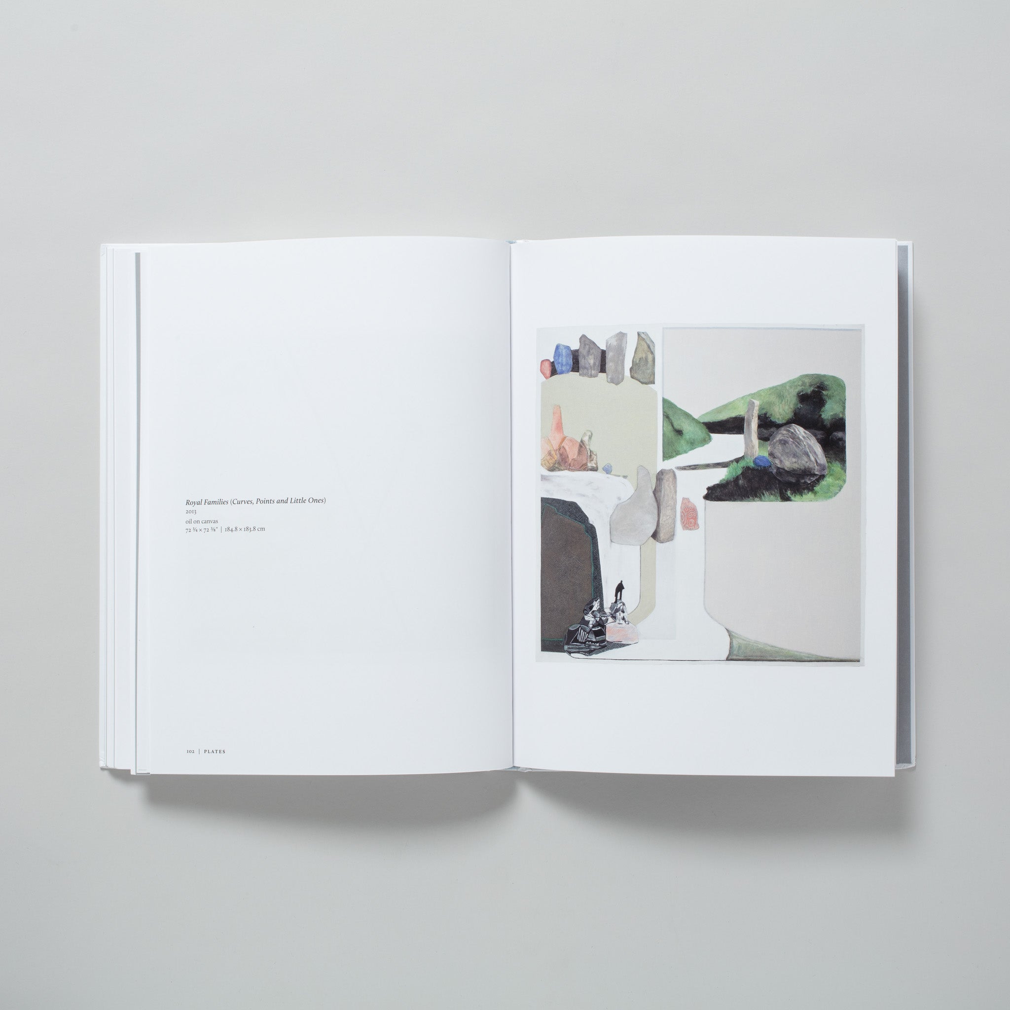 The book is open to two pages. The right has a work by the artist and the left has a description of the work.