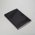 Blackness in Abstraction. The book is laying flat and has a black cloth cover with black font.