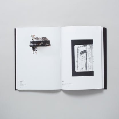 The book is open to two pages. Each page has an image of an artwork by the artist Pope.L.