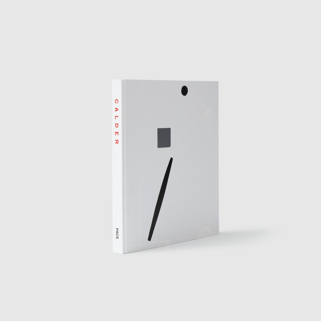The book is standing upright with white and black shapes on the cover. It says Calder in red letters down the spine with Pace in black letters at the base of the spine.