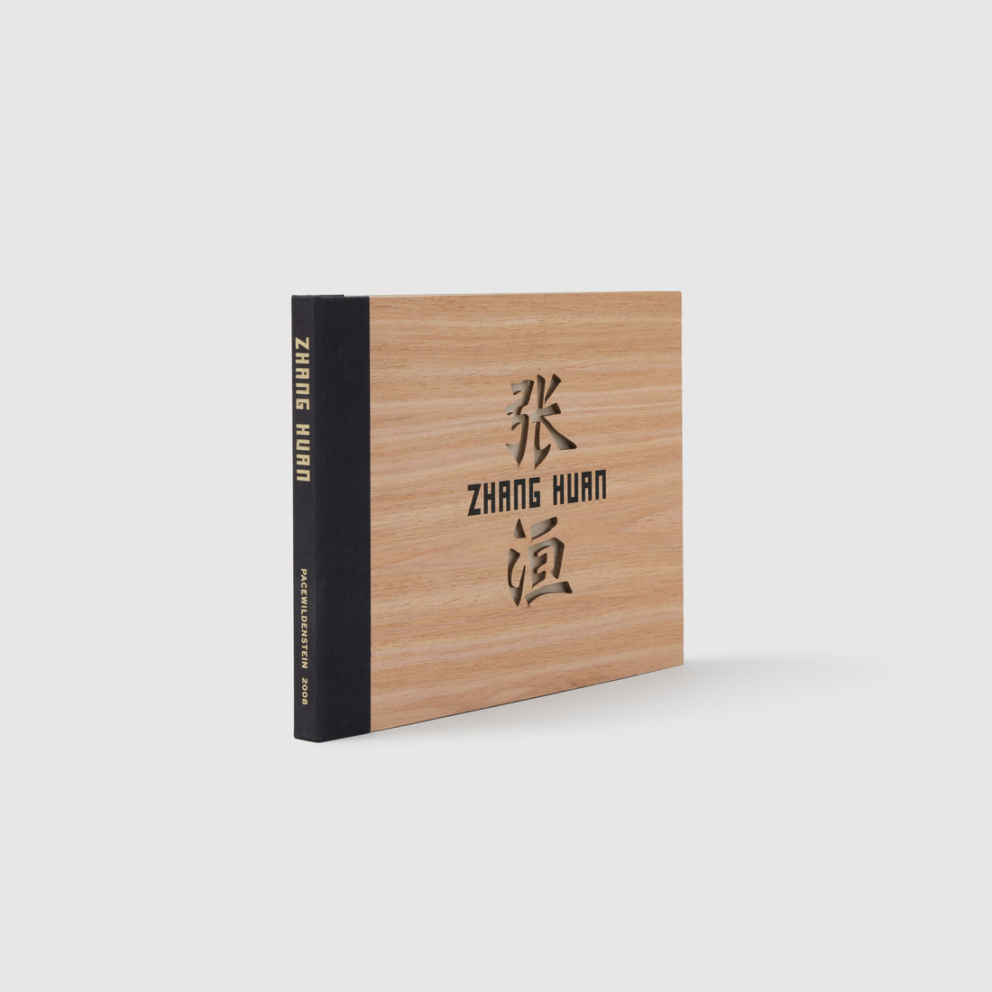 Zhang Huan. The cover is made of wood and has cutouts. The spine is black.