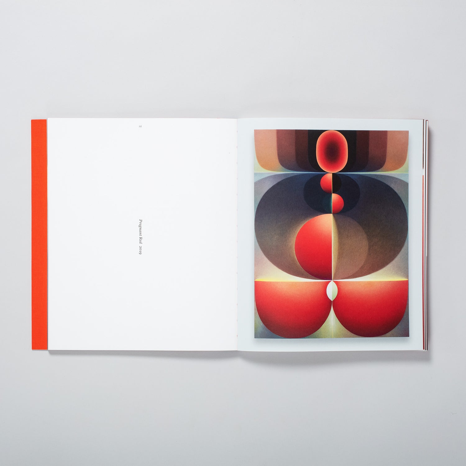 The book is open to two pages with the Loie Hollowell work Pregnant Red on the right page and the name of the work on the left page.