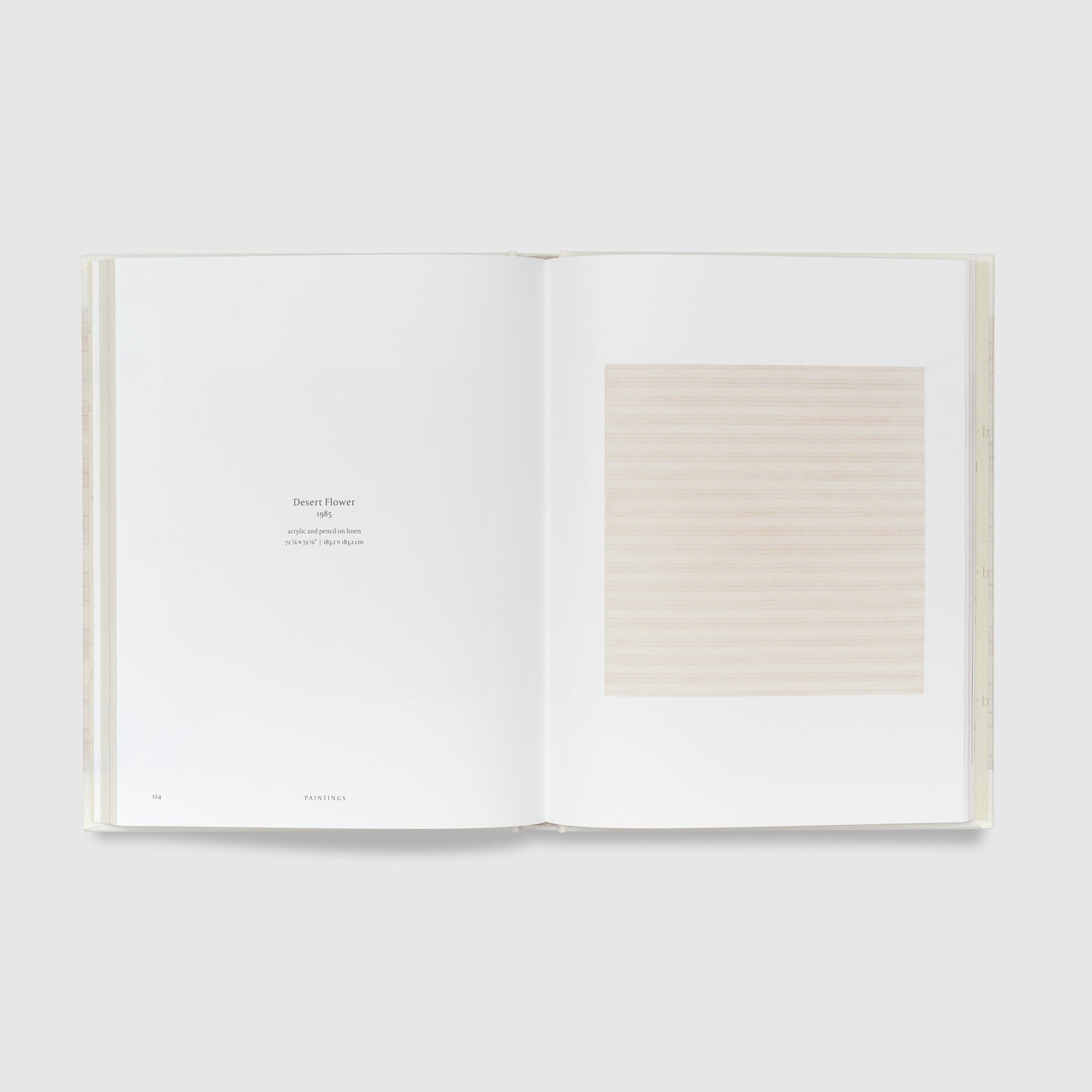 The book is open to two pages. The right page features the Agnes Martin work Desert Flower and the left page has black text describing the work.