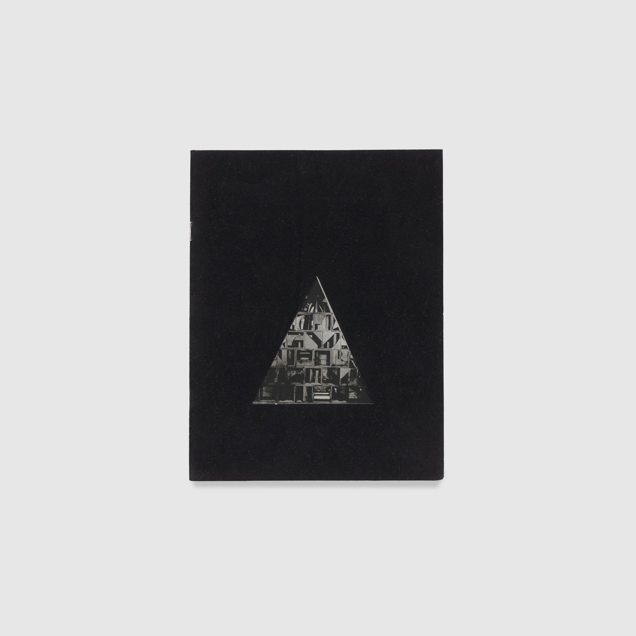 The cover is black with a triangle that has a black and white Nevelson work inside of it.