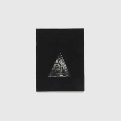 The cover is black with a triangle that has a black and white Nevelson work inside of it.