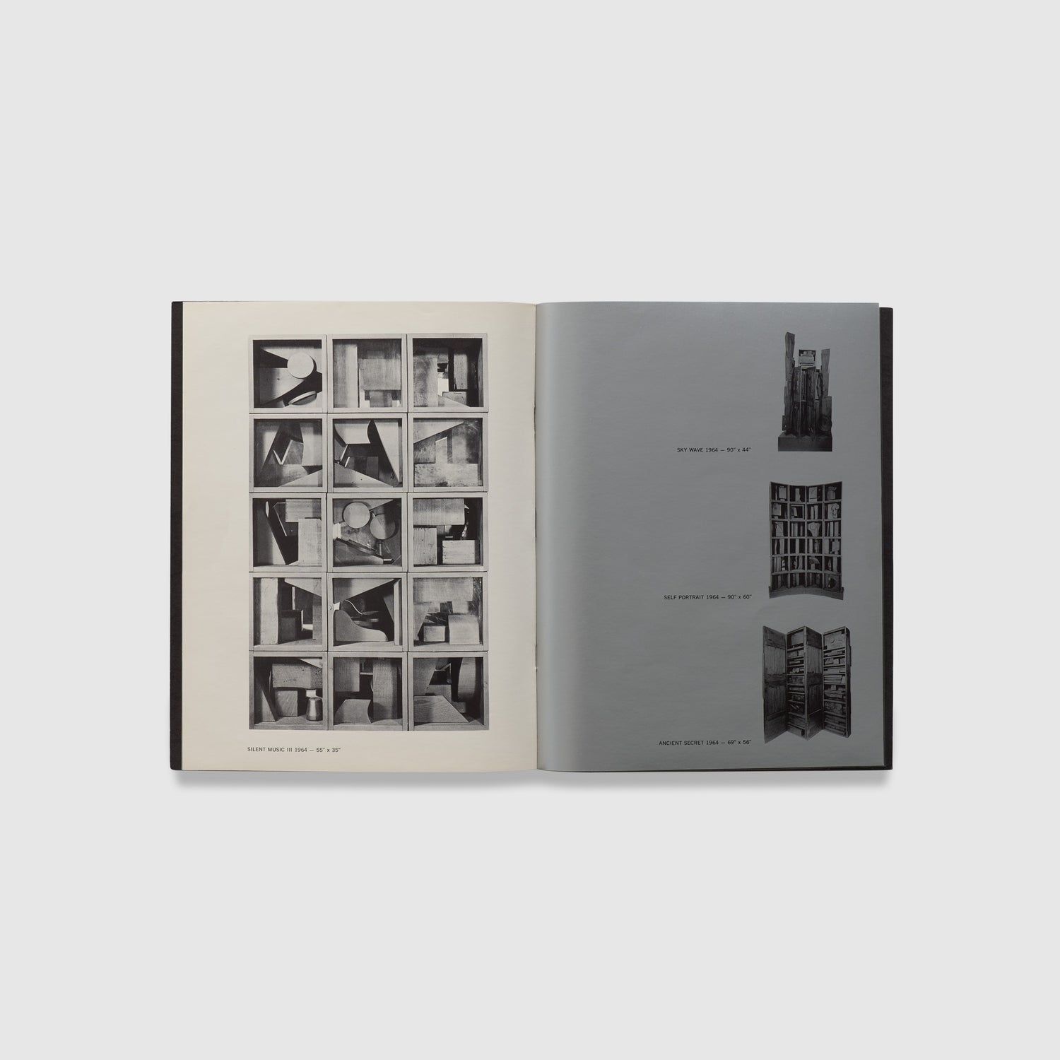 The book is open to two pages. Both pages have black and white photographs of Nevelson works.