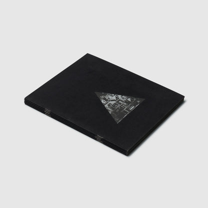 The cover is black with a triangle that has a black and white Nevelson work inside of it.