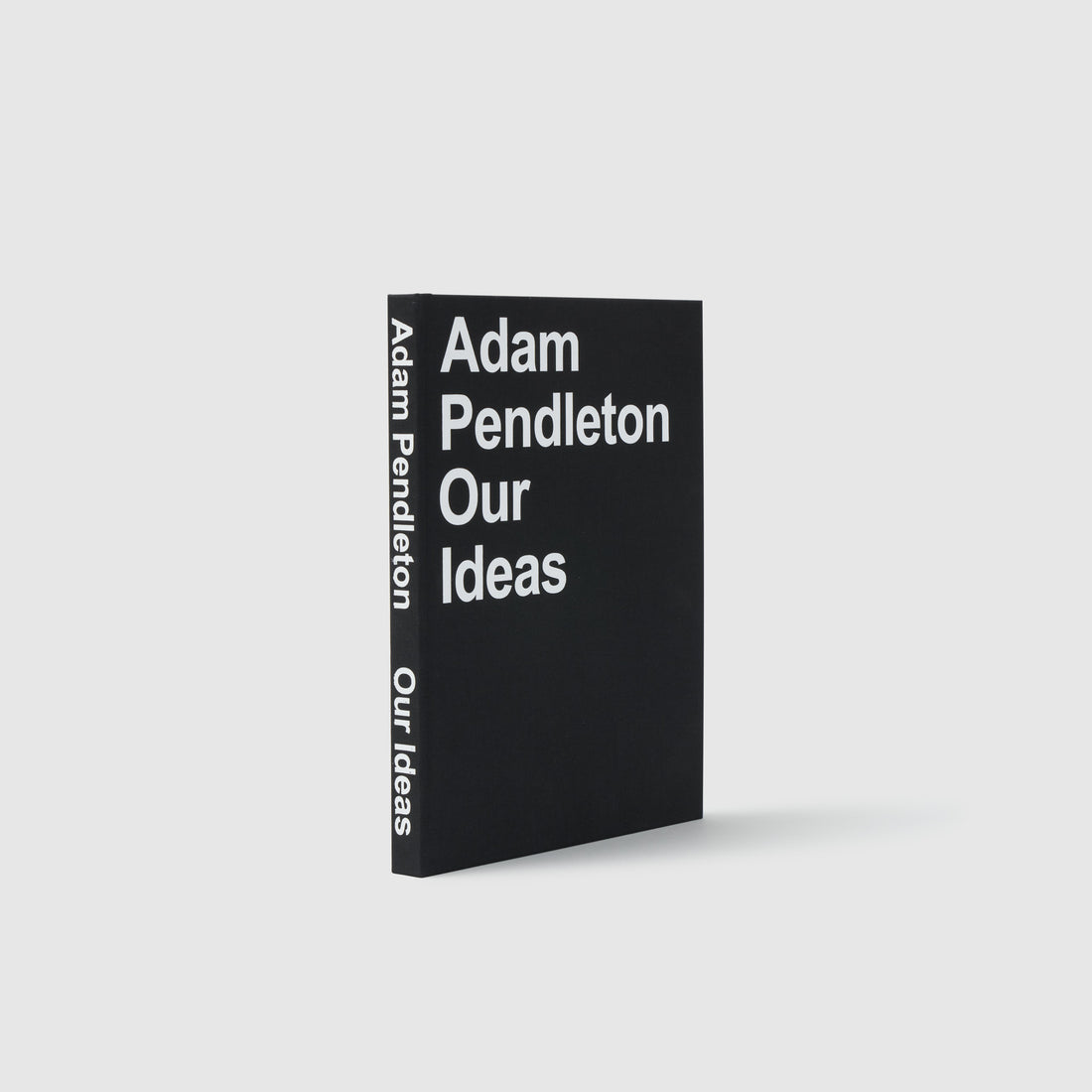 Adam Pendleton Our Ideas by Suzanne Hudson, Alec Mapes-Francis, Yvonne Rainer, and Adam Pendleton. The book is upright and has a cloth cover with white text.