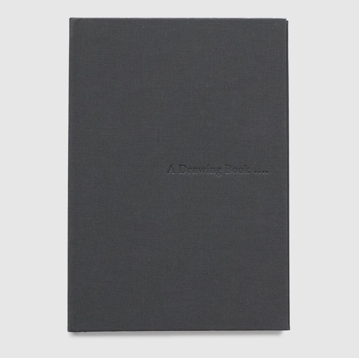 A Drawing Book. The cover is dark grey and the title is stamped into the cover.