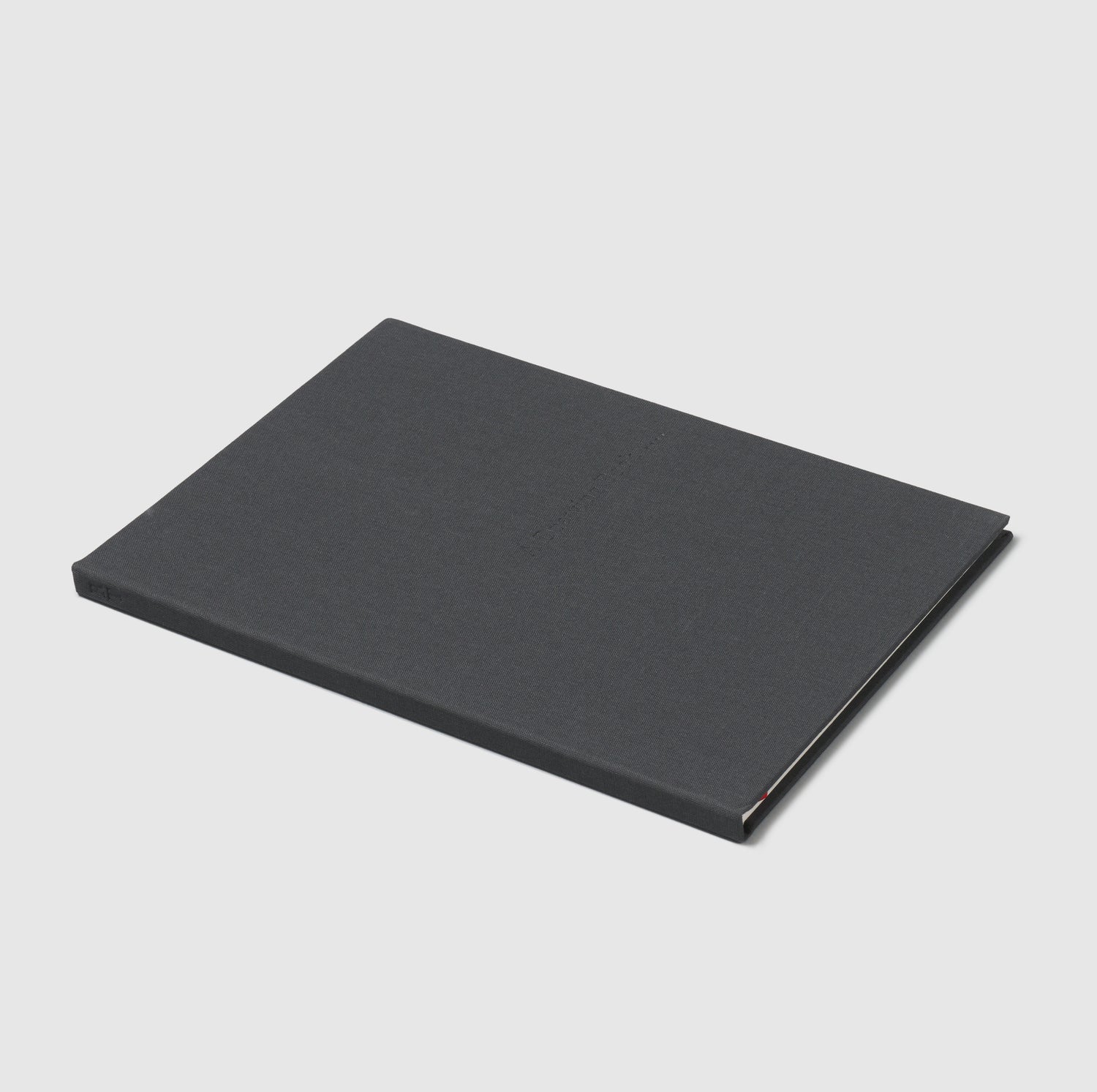 A Drawing Book. The cover is dark grey and the title is stamped into the cover.