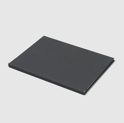 A Drawing Book. The cover is dark grey and the title is stamped into the cover.