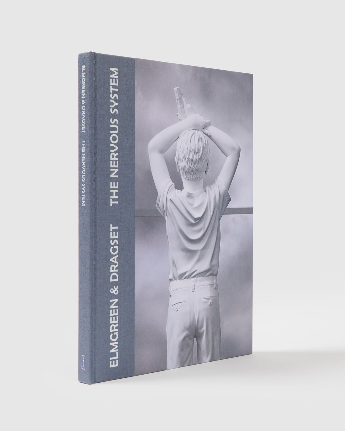 Elmgreen &amp; Dragset The Nervous System. The cover has a blue spine and has an image of an Elmgreen &amp; Dragset work on it.