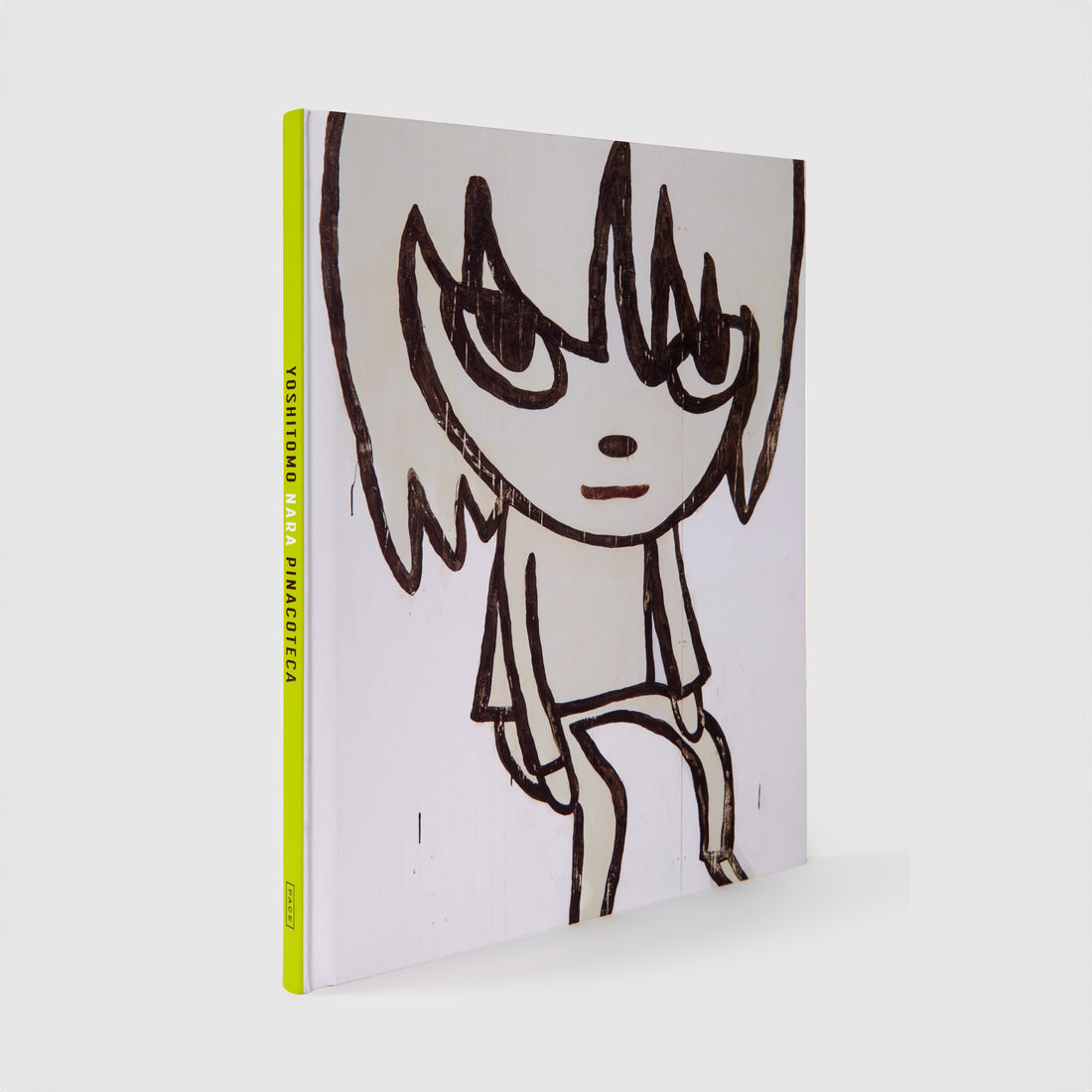 Yoshitomo Nara Pincoteca. The book has a black and white Nara work on the cover. There is a green spine with black and white font.