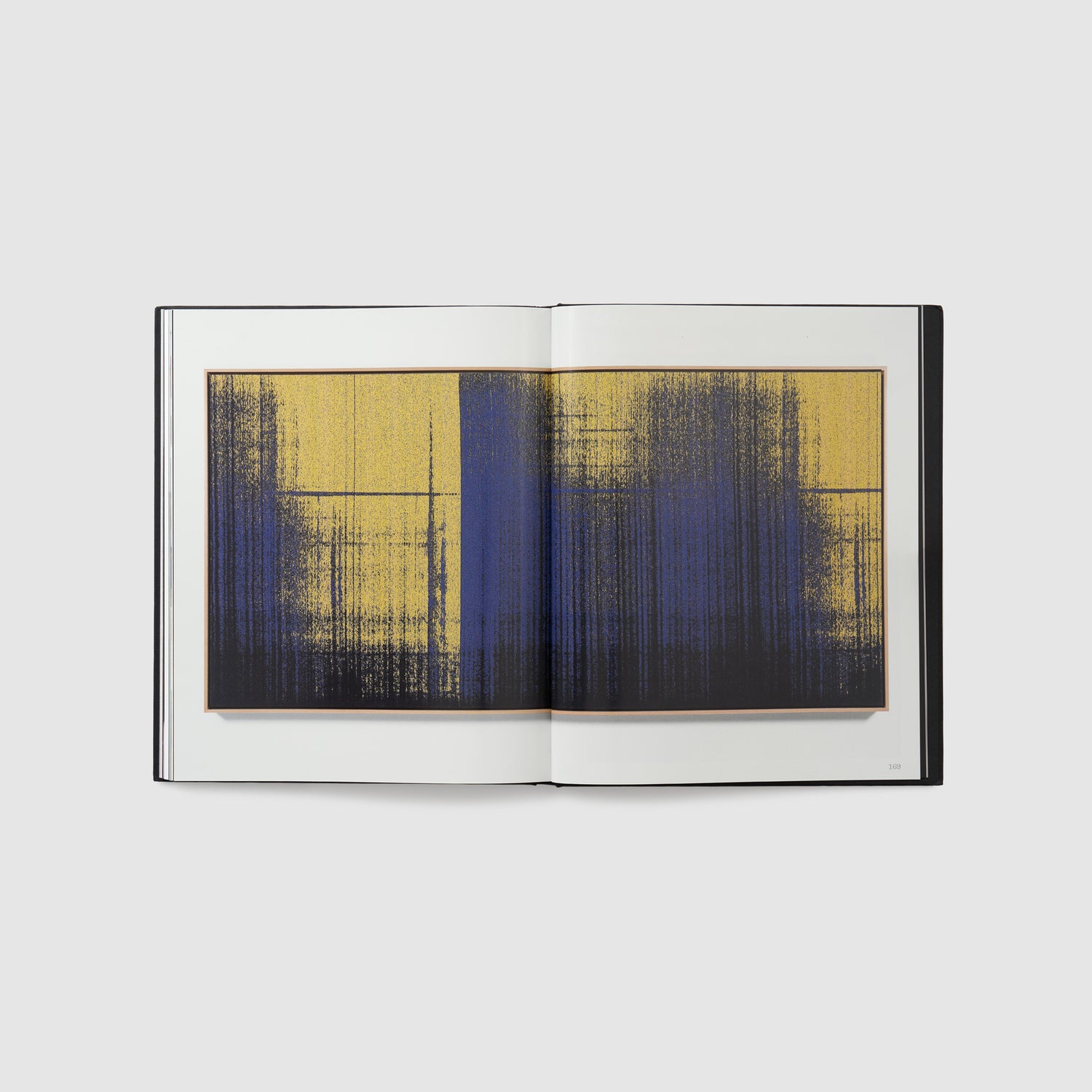 The book is open to two pages. There is an image of the artists work across both pages. The work is woven and has yellow, blue, and black colors.