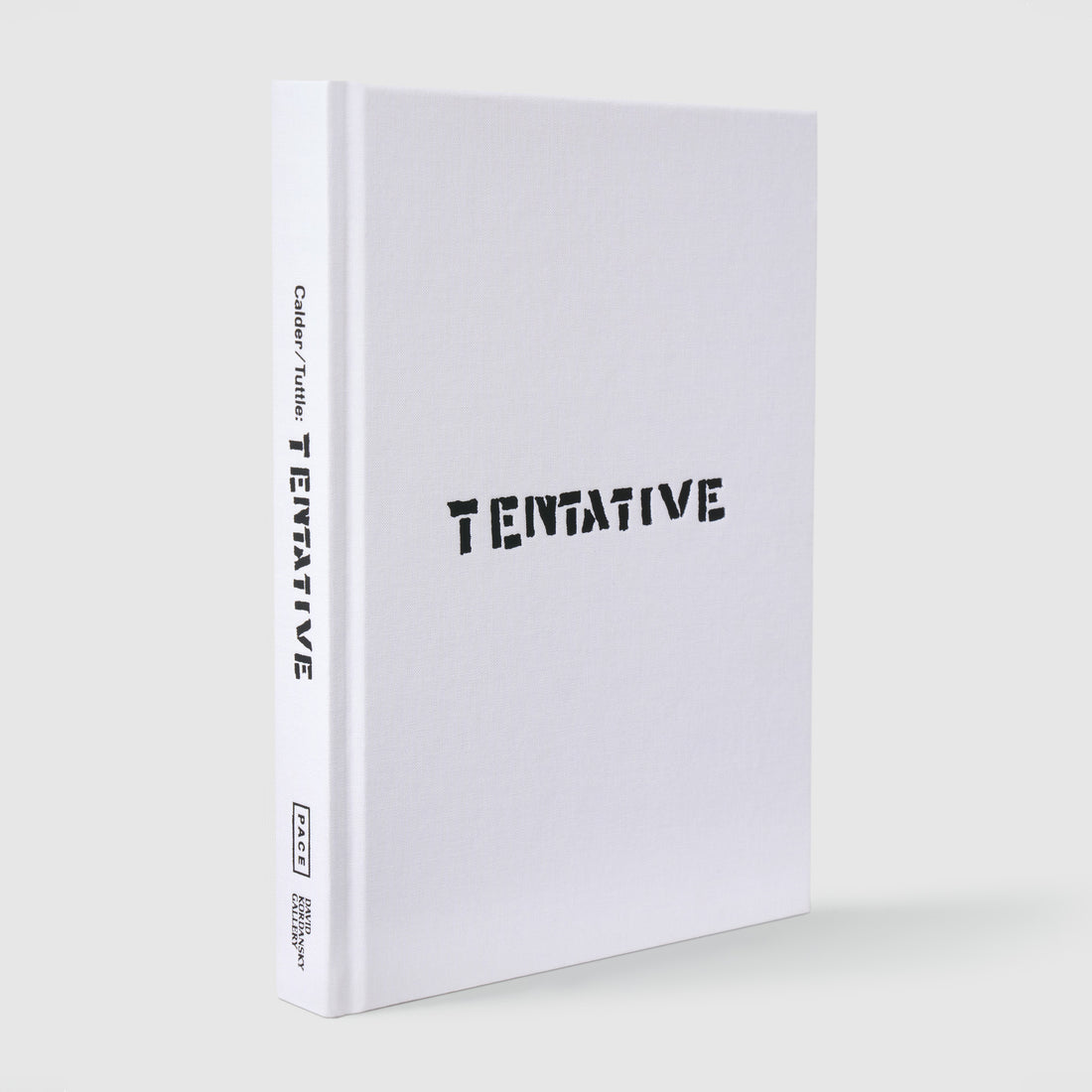 Calder Tuttle Tentative. The book has a white fabric cover with black text.